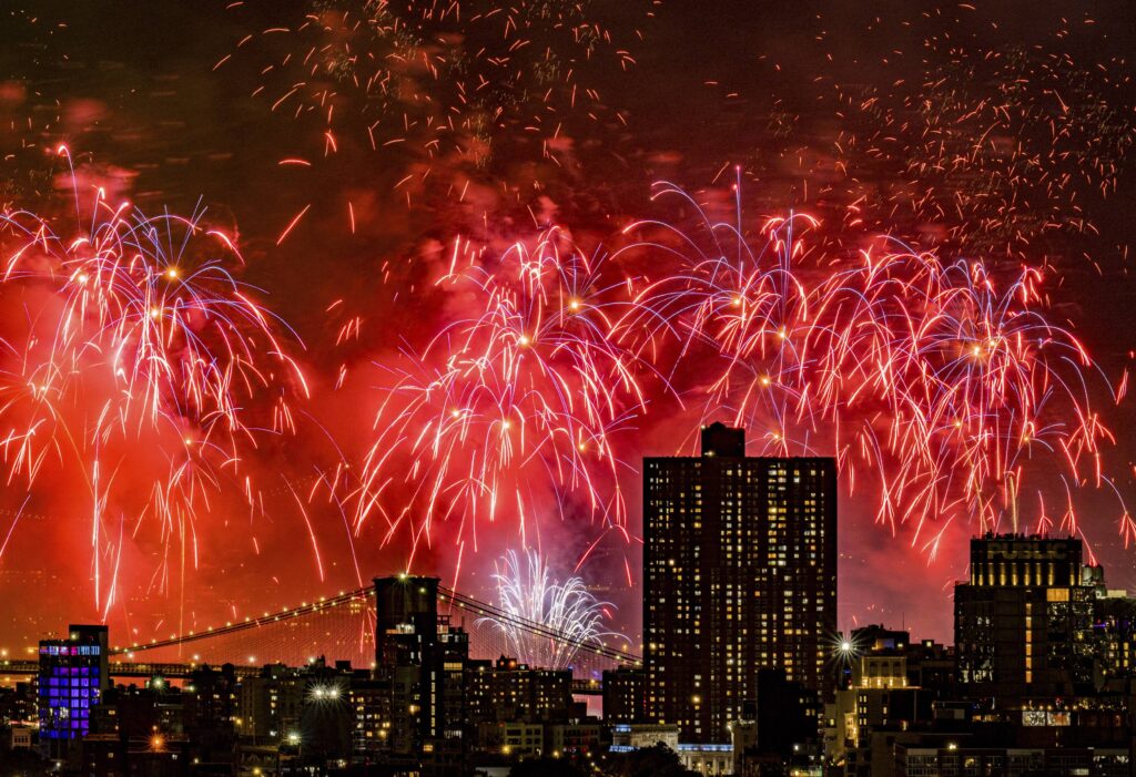 Fireworks explode over the East River and Brooklyn Bridge during the Macy's 4th of July Fireworks Show on July 4, 2025 in New York. Photo: Evan Agostini/Invision/AP