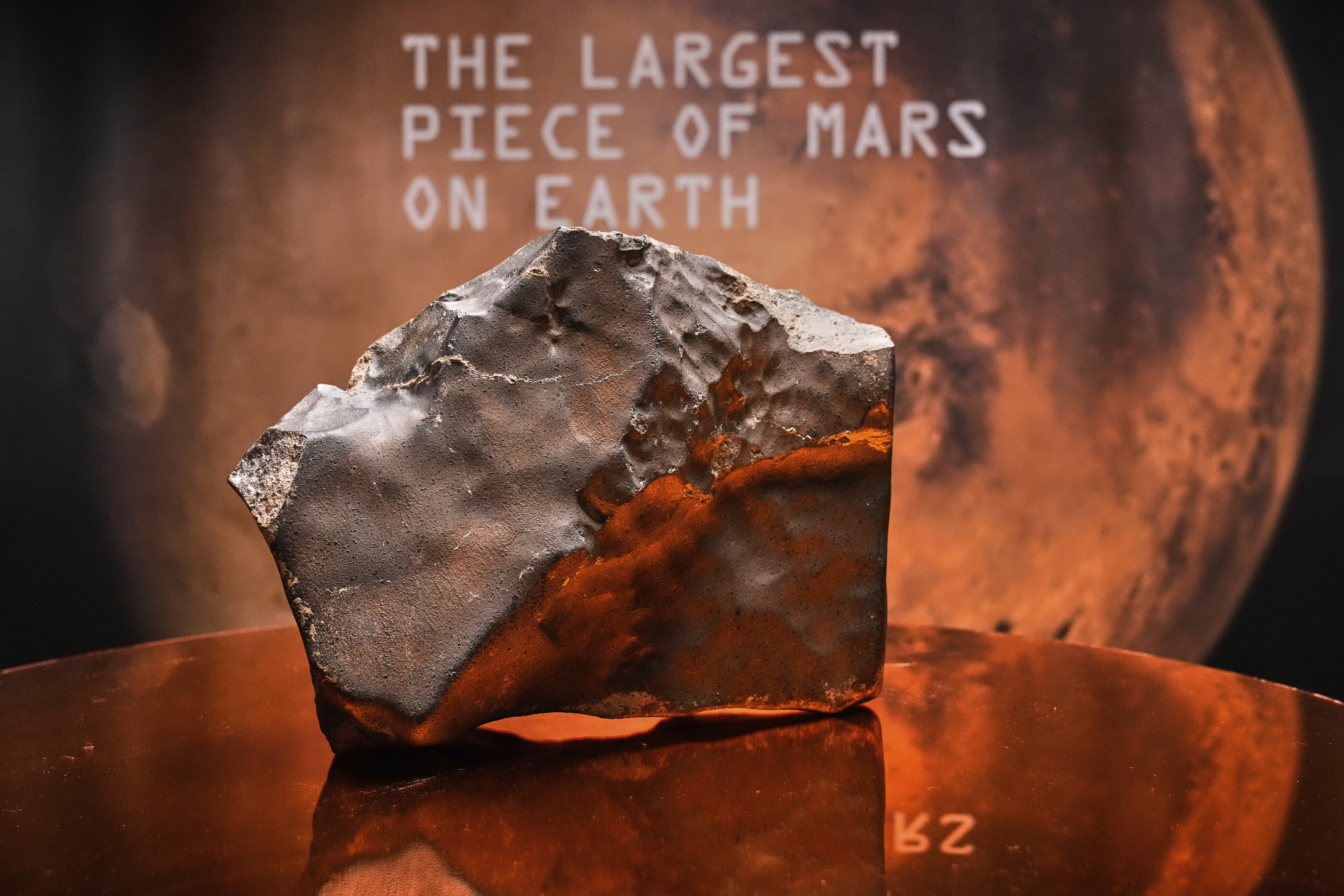 A Martian meteorite, weighing 54.388 lbs. (24.67 kg), said to be the largest piece of Mars on Earth, estimated at $2 - 4 million, is displayed at Sotheby's, in New York, Wednesday, July 9, 2025, part of their Geek Week auction, July 16, 2025. AP Photo/Richard Drew