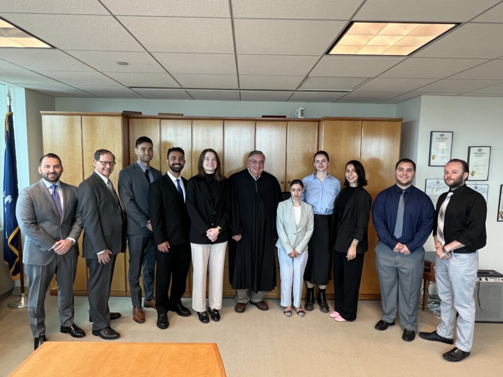 From left: Nicholas Liakas, Esq.; Judge Mark Partnow; Brandon Brockner; Cody Hazboun; Kailey Bruce; Judge Matthew D’Emic; Amanda Ramirez; Ainsley Garipoli; Anna Vinnikov; Dylan Swincicki; and Brandon Amato. Brooklyn Eagle photo by Wayne Daren Schneiderman