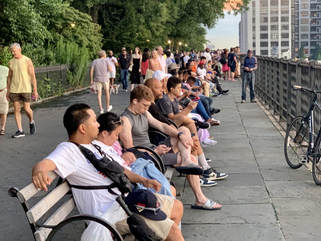 A crowd settles in to view the 4th of July fireworks from the Brooklyn Heights Promenade in 2023. Brooklyn Eagle photo by Mary Frost