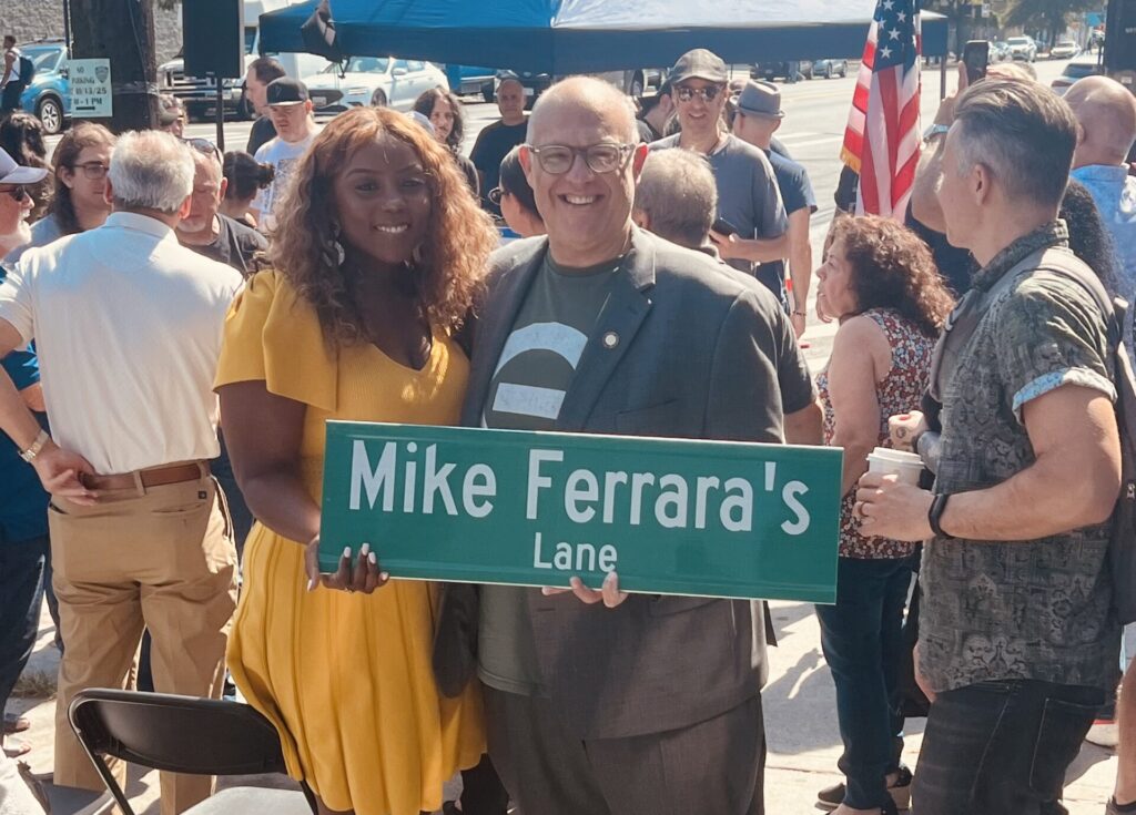Councilmembers Justin Brannan, D-47, and Farah Louis, D-45, display Mike Ferrara’s Lane. Photo by Wayne Daren Schneiderman
