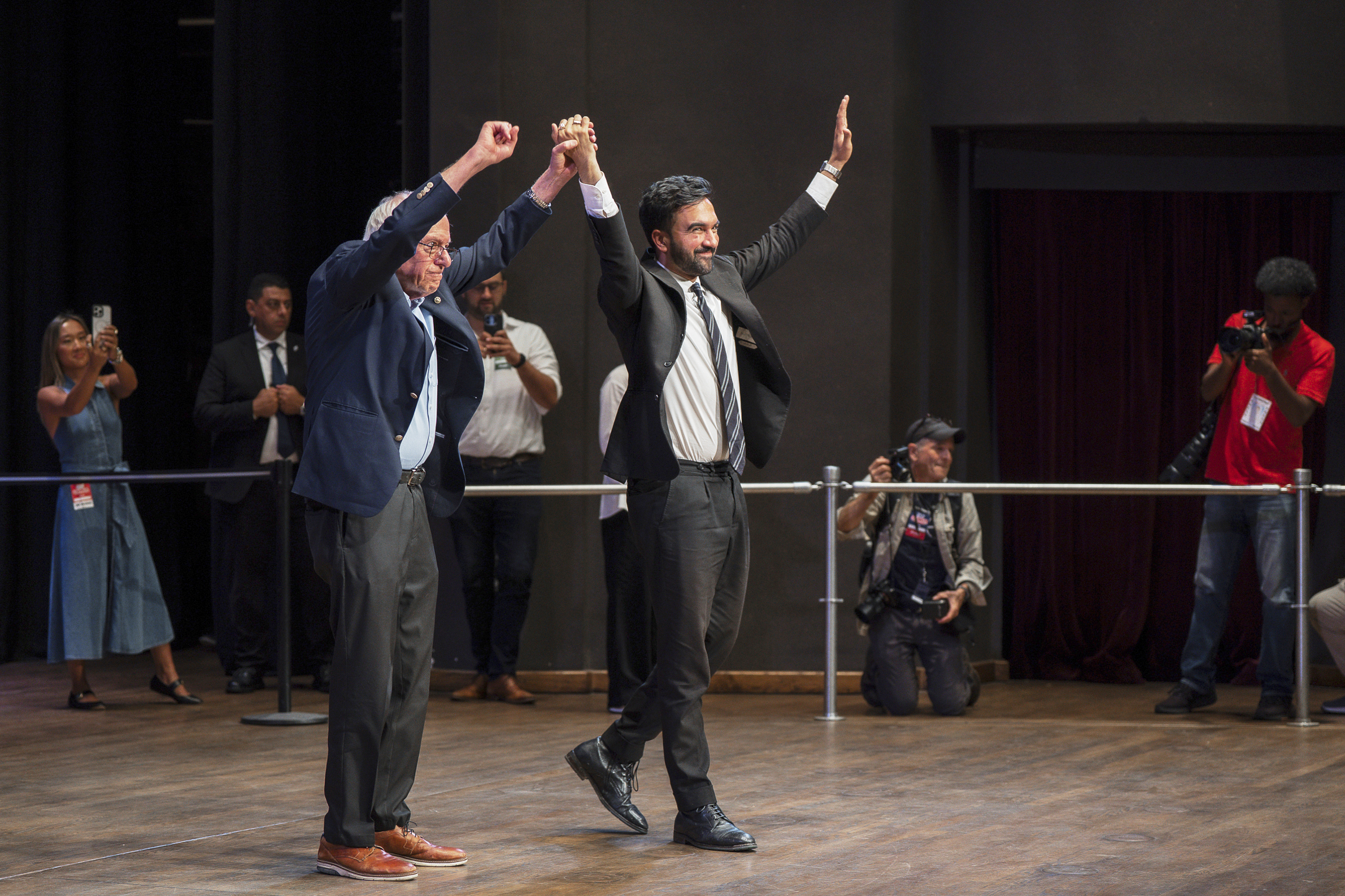 Sen. Bernie Sanders, I-Vt., left, and New York City mayoral candidate Zohran Mamdani greet the crowd during a town hall at Brooklyn College on Saturday, Sept, 6, 2025. AP Photo/Olga Fedorova