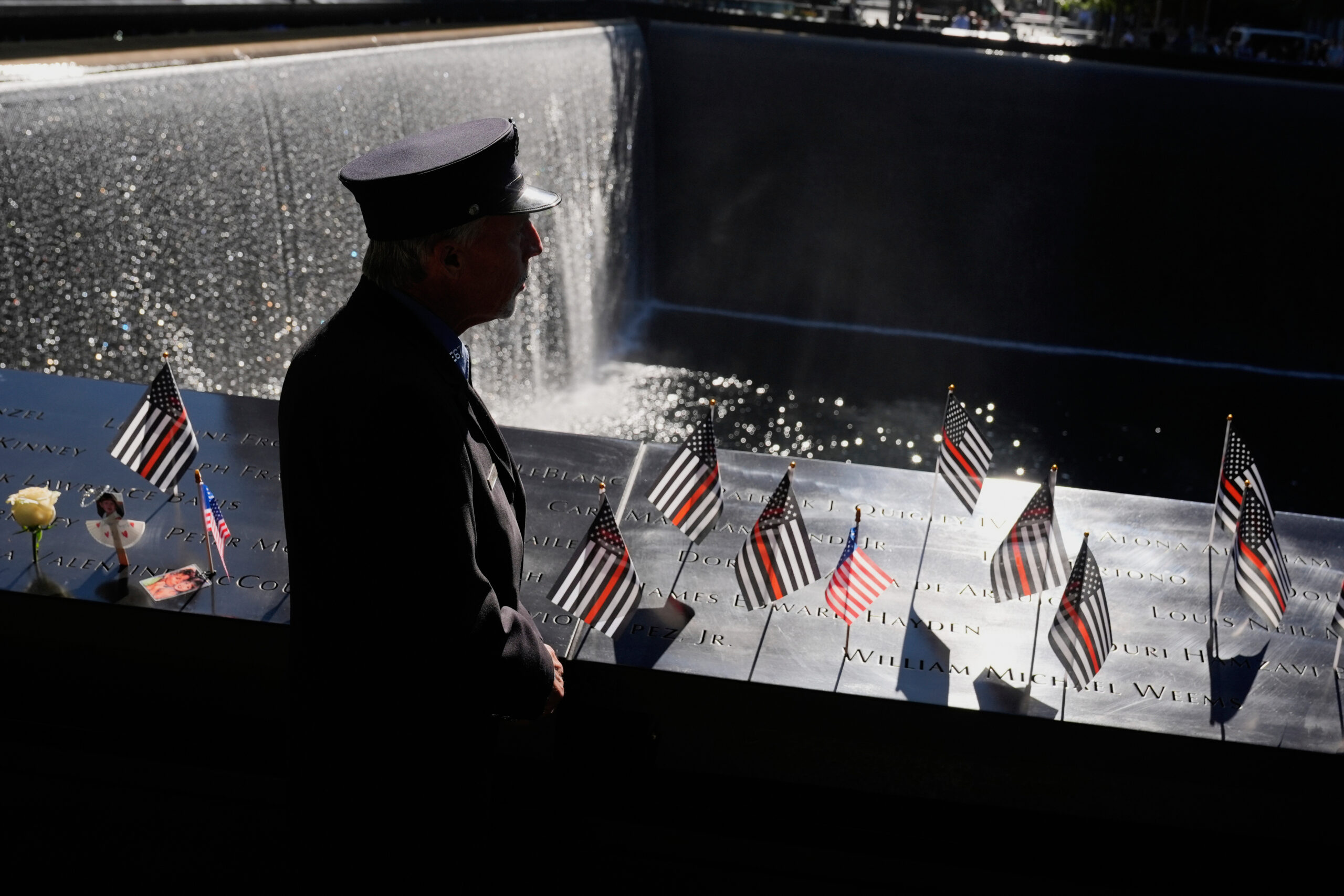 William Staudt, a firefighter that worked at Ground Zero on the day of the attacks, looks over a reflecting pool during a ceremony to mark the 24th anniversary of the 9/11 attacks, Thursday, Sept. 11, 2025, in New York. AP Photo/Seth Wenig