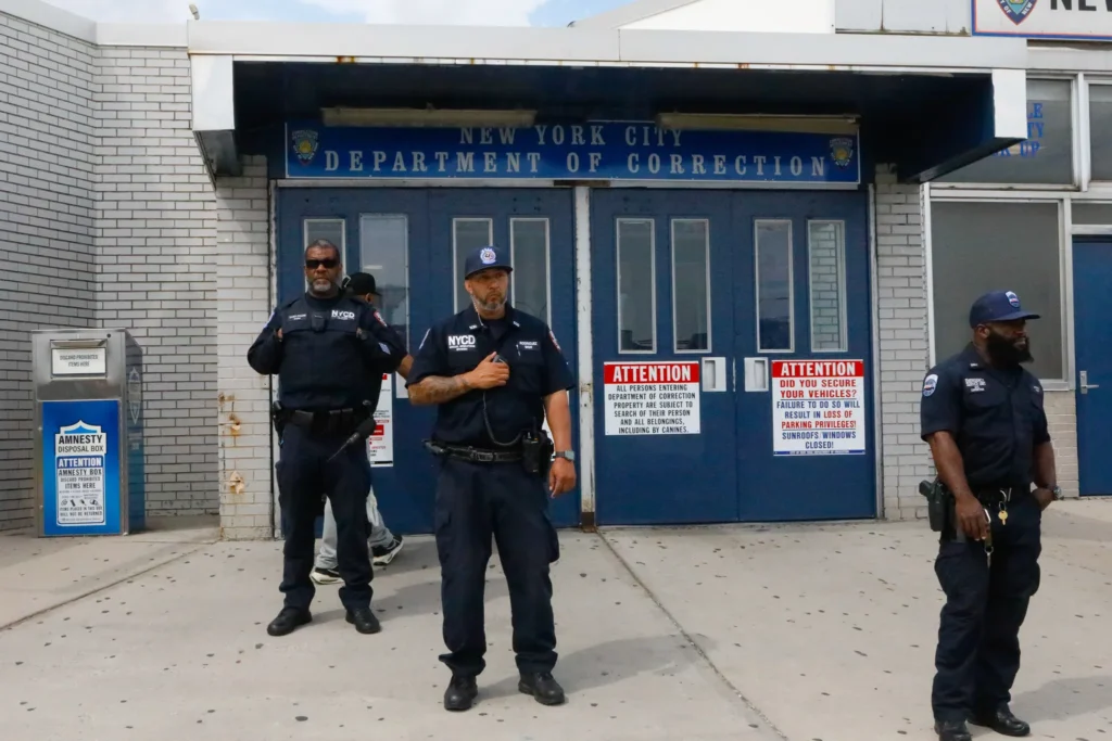 Correction officers were stationed outside the Rikers Island visitor entrance, Aug. 28, 2025. Photo: Alex Krales/THE CITY