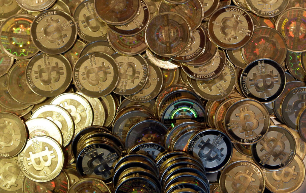 This April 3, 2013, file photo shows bitcoin tokens in Sandy, Utah. AP Photo/Rick Bowmer, File