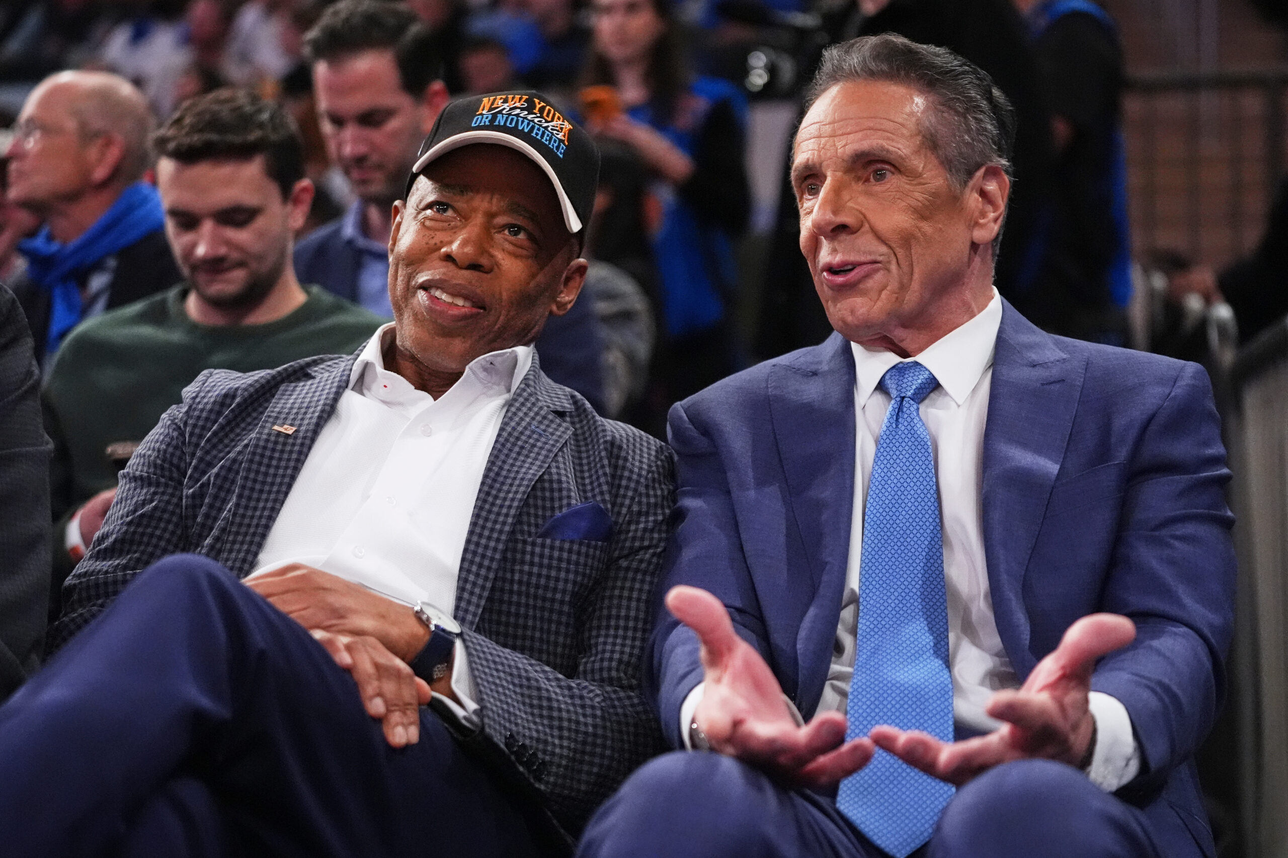 New York City Mayor Eric Adams, left, and Independent candidate former New York Gov. Andrew Cuomo, right, speak during the second half of an NBA basketball game between the New York Knicks and the Cleveland Cavaliers Wednesday, Oct. 22, 2025, at Madison Square Garden in New York. AP Photo/Frank Franklin II