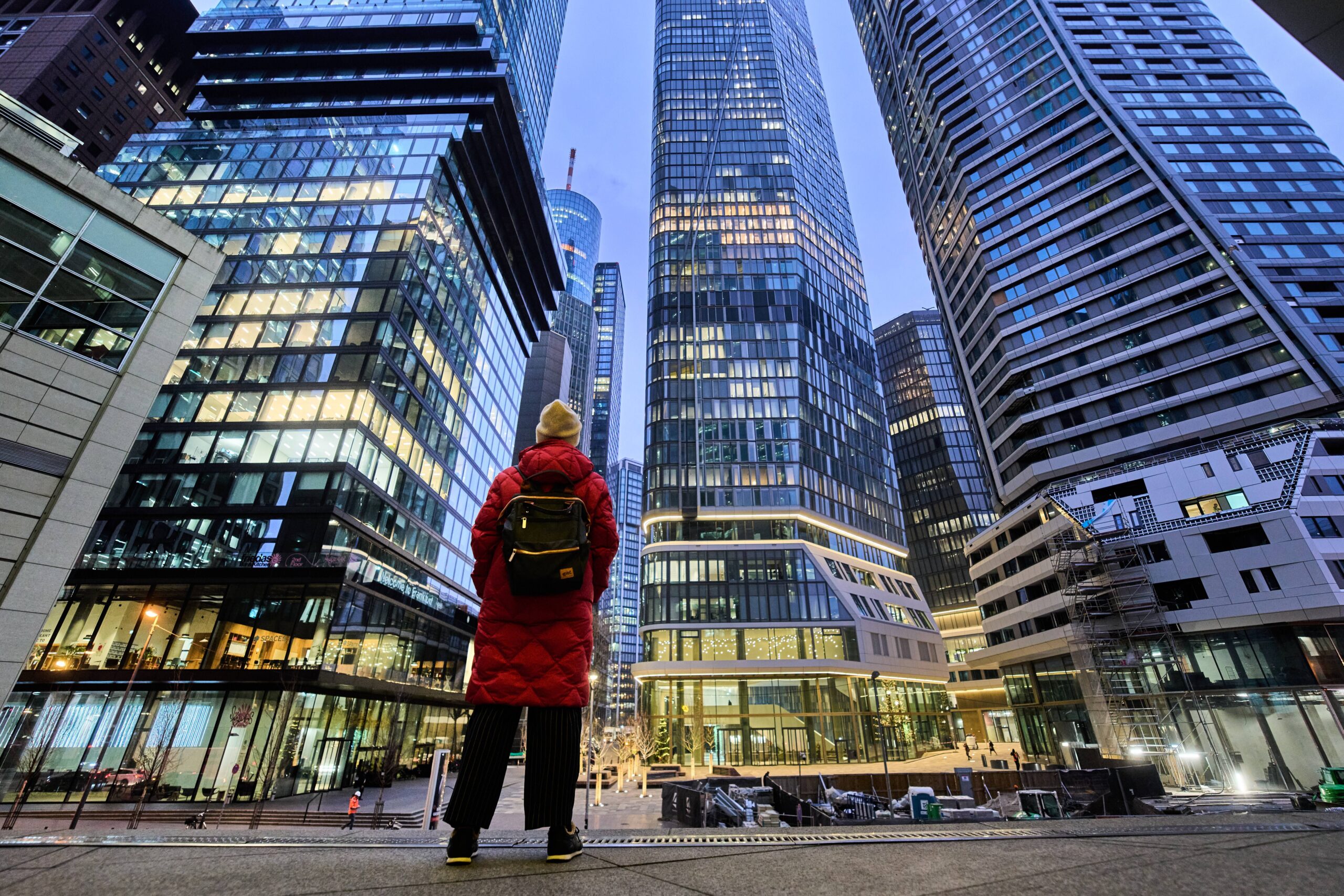 A woman looks at office towers in downtown Frankfurt, Germany, Wednesday, Dec. 3, 2025. Photo: Michael Probst/AP