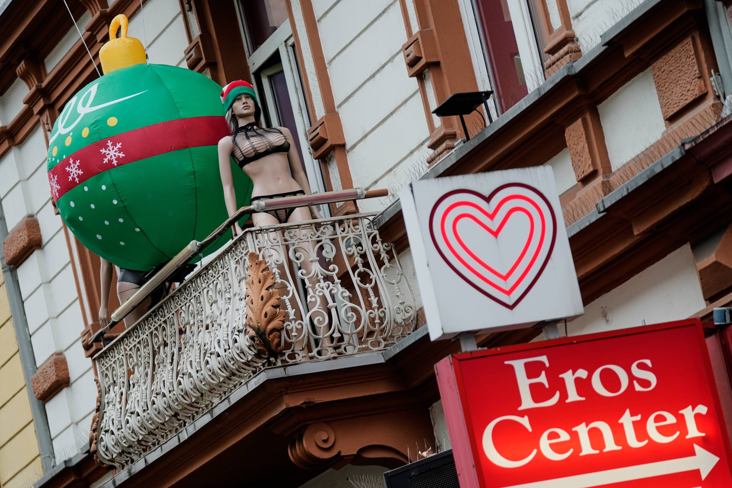 CORRECTS CAPTION TO CONFORM WITH AP STYLE A building used by sex workers is decorated for Christmas in the red light district in Frankfurt, Germany, Monday, Dec. 8, 2025. Photo: Michael Probst/AP