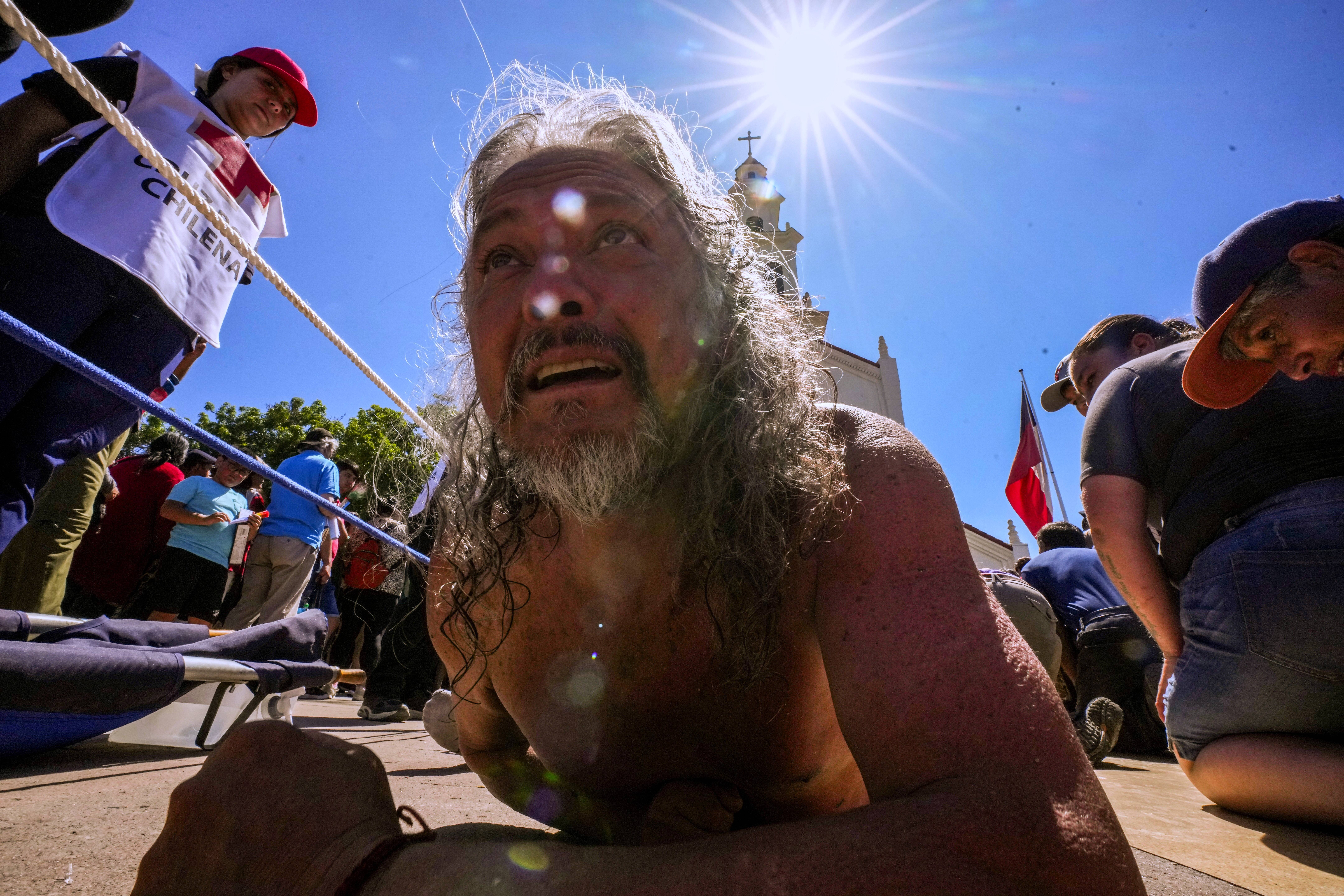 A pilgrim crawls to the Sanctuary of Lo Vasquez during an annual celebration marking the Immaculate Conception of the Virgin Mary, in Valparaiso, Chile, Monday, Dec. 8, 2025. Photo: Esteban Felix/AP