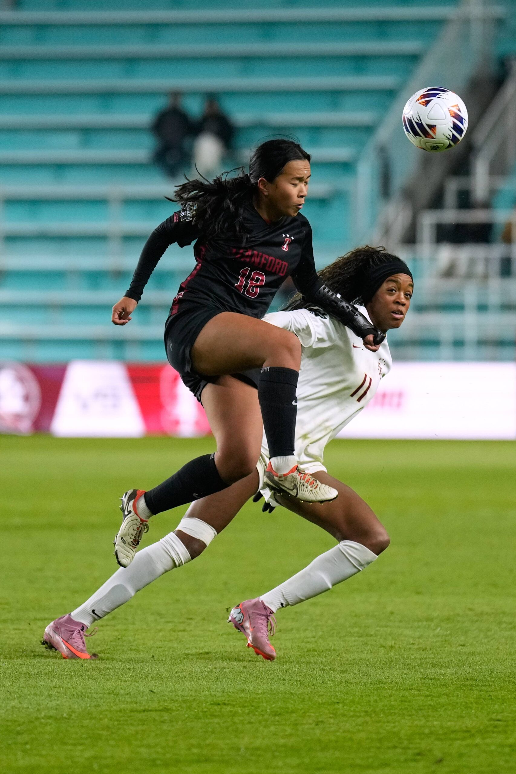 Stanford's Y-Lan Nguyen (18) and Stanford's Eleanor Klinger (11) battle for the ball during the first half of the NCAA college soccer tournament final Monday, Dec. 8, 2025, in Kansas City, Mo. Photo: Charlie Riedel/AP