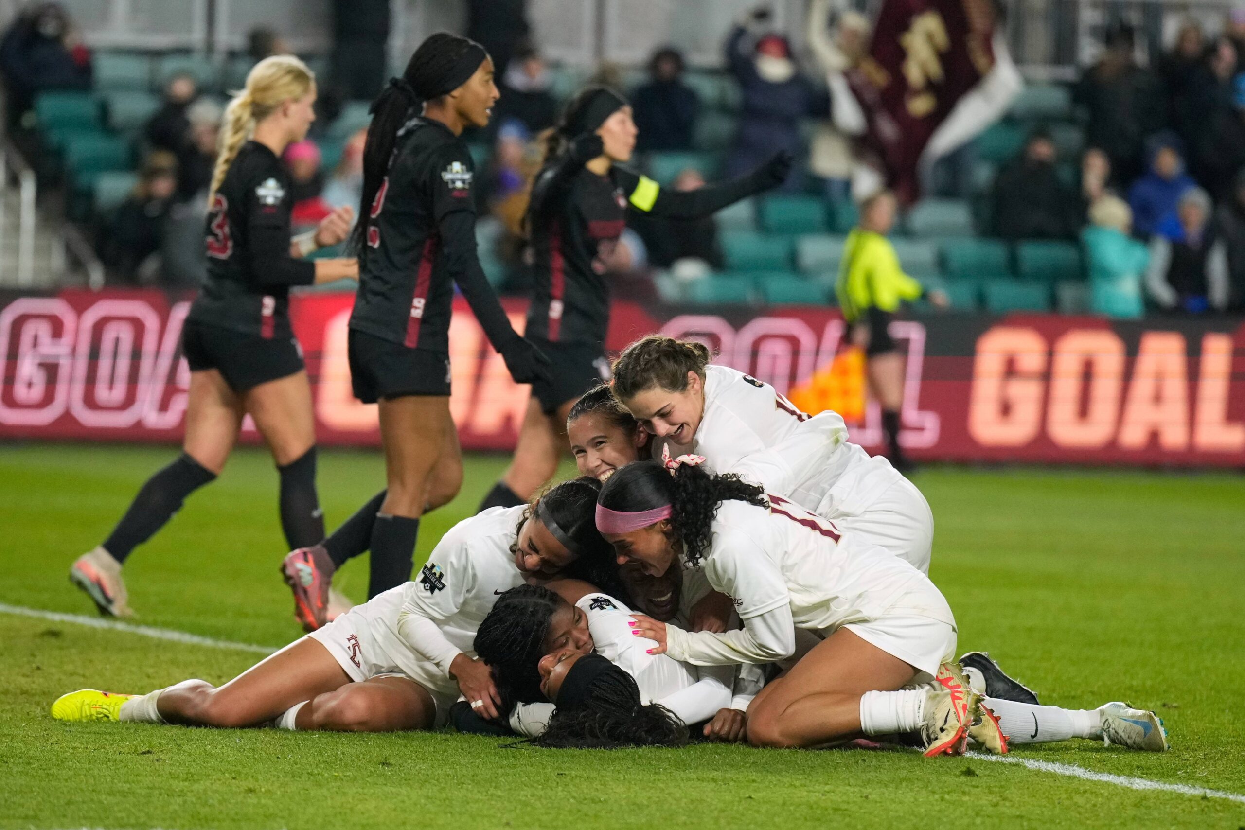 Florida State players mob teammate Wrianna Hudson after Hudson scored during the second half of the NCAA college soccer tournament final against Stanford Monday, Dec. 8, 2025, in Kansas City, Mo. Photo: Charlie Riedel/AP