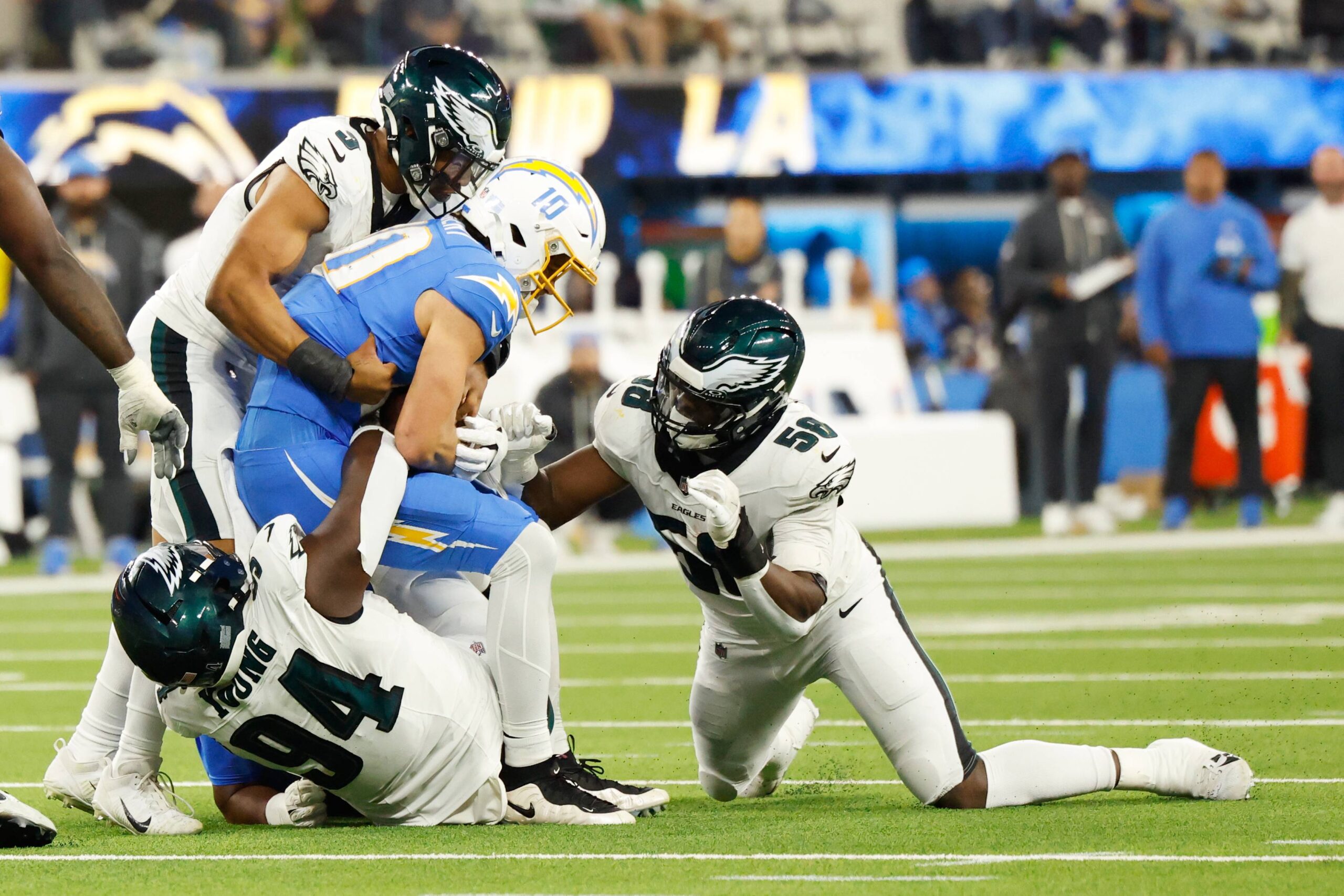Los Angeles Chargers quarterback Justin Herbert (10) is sacked by Philadelphia Eagles defensive tackle Byron Young (94) during the second half of an NFL football game Monday, Dec. 8, 2025, in Inglewood, Calif. Photo: Caroline Brehman/AP