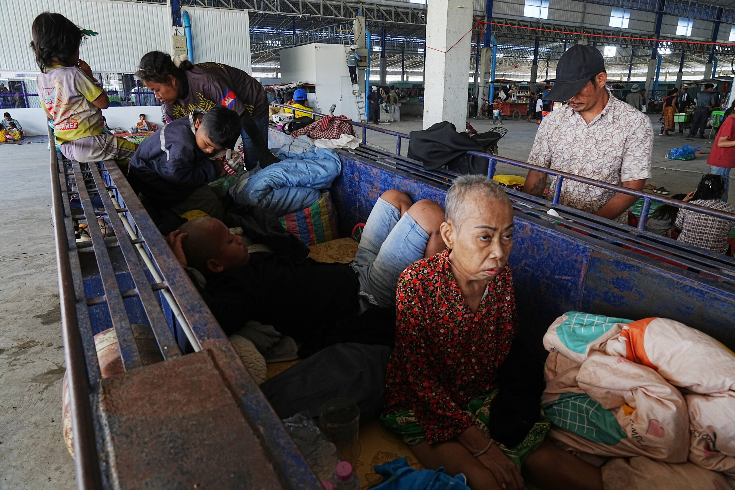 Local people take refuge in Prey Chamkar Ta Doak market in Banteay Meanchey province in Cambodia, near the border with Thailand, Tuesday, Dec. 9, 2025. Photo: Heng Sinith/AP