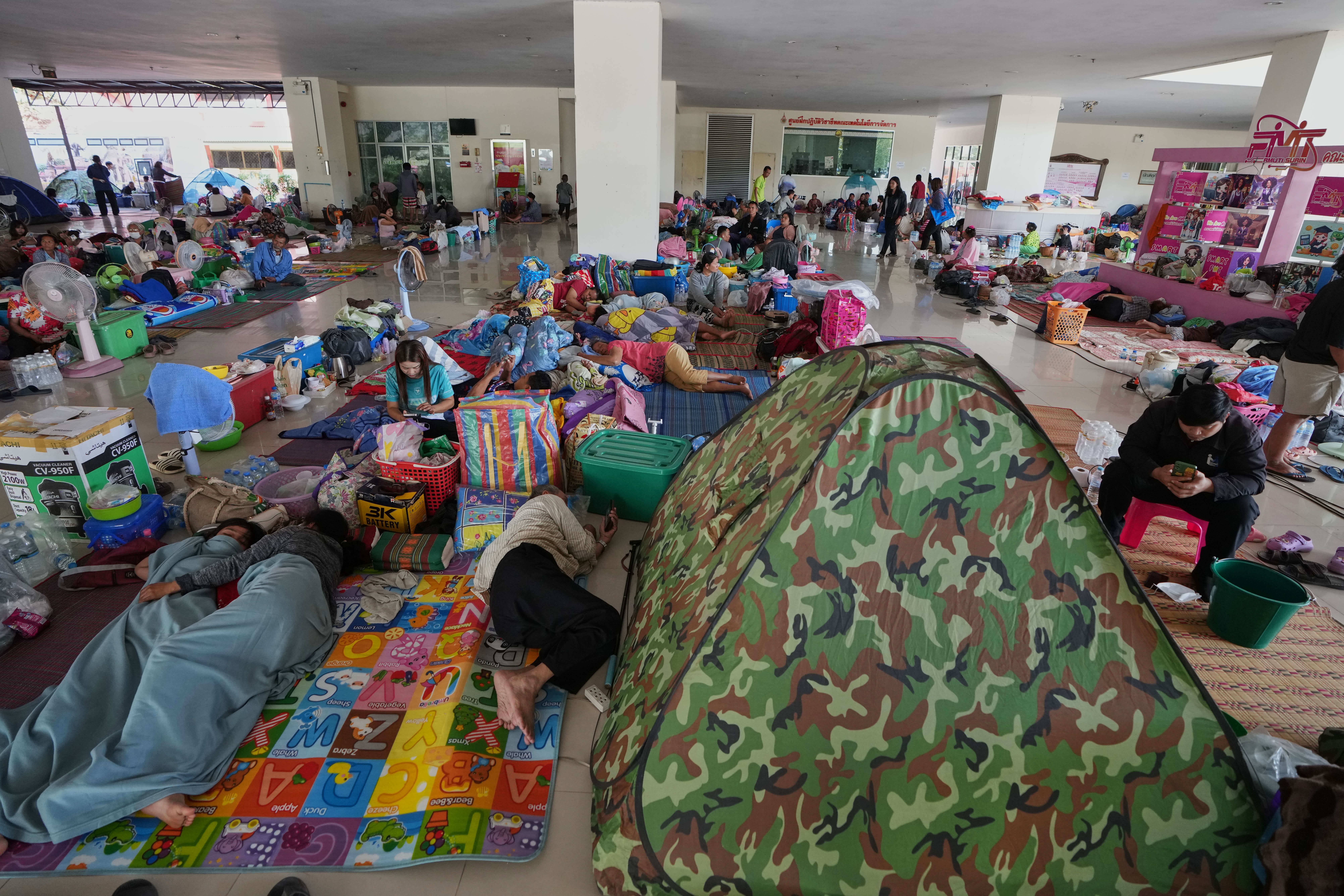 Thai residents who fled homes following clashes between Thai and Cambodian soldiers rest at an evacuation center in Surin province, Thailand, Tuesday, Dec. 9, 2025. Photo: Sakchai Lalit/AP