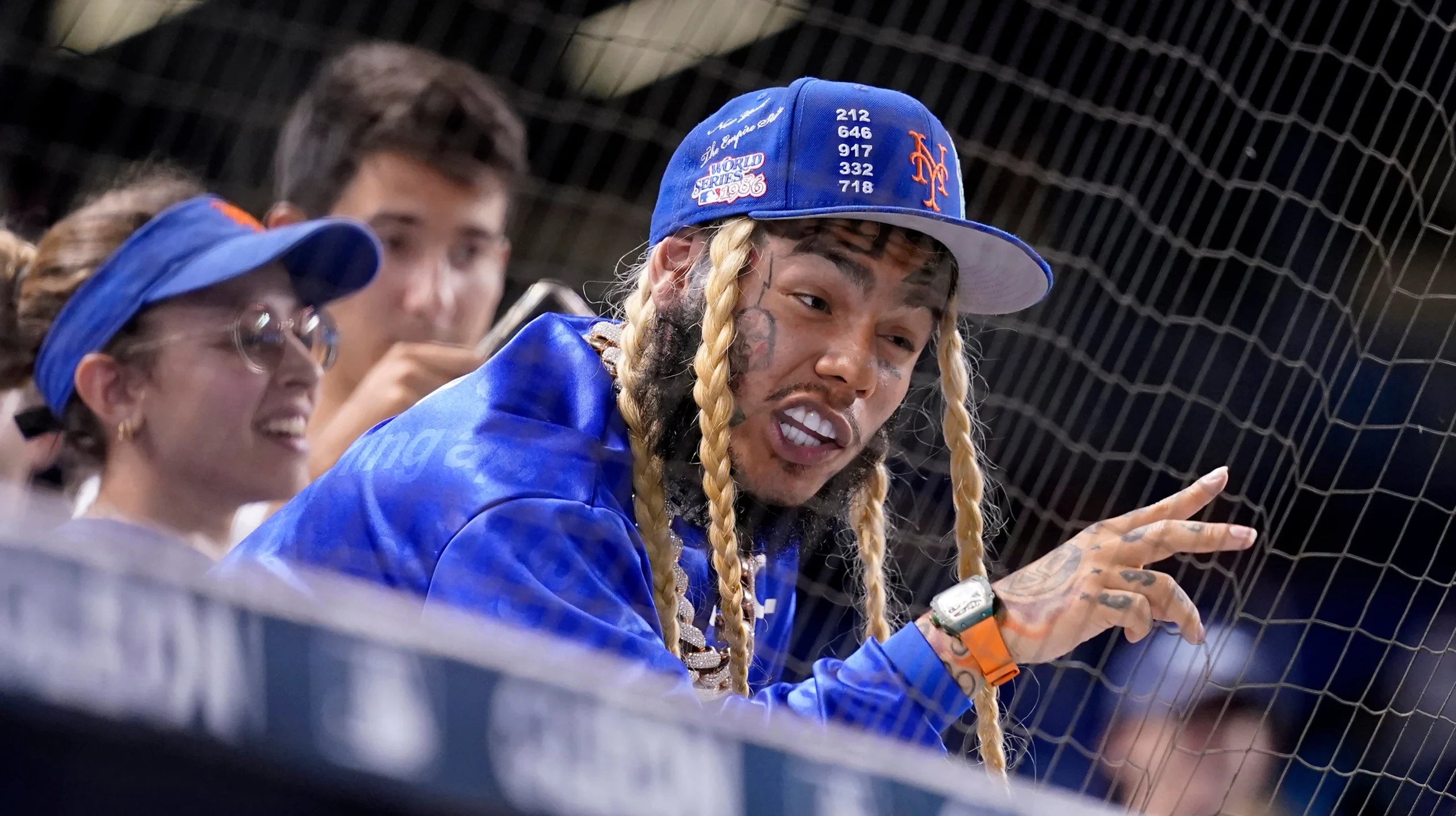 Rapper Tekashi 6ix9ine watches a baseball game between the Miami Marlins and New York Mets, Aug. 3, 2021, in Miami. Photo: Lynne Sladky/AP