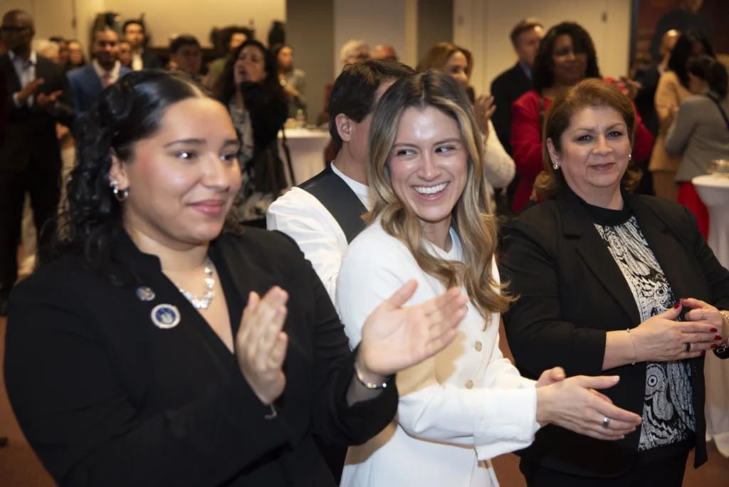 Guests Applauding. Brooklyn Eagle photo by John McCarten