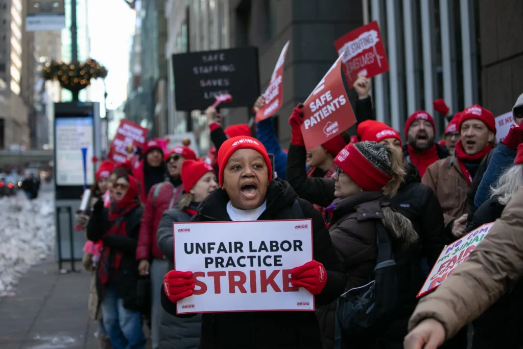 Striking nurses march from Grand Central to Gov. Kathy Hochul’s Midtown office to call on her to help pressure hospital executives into reaching an agreement, Feb. 2, 2026. Credit: Ben Fractenberg/THE CITY