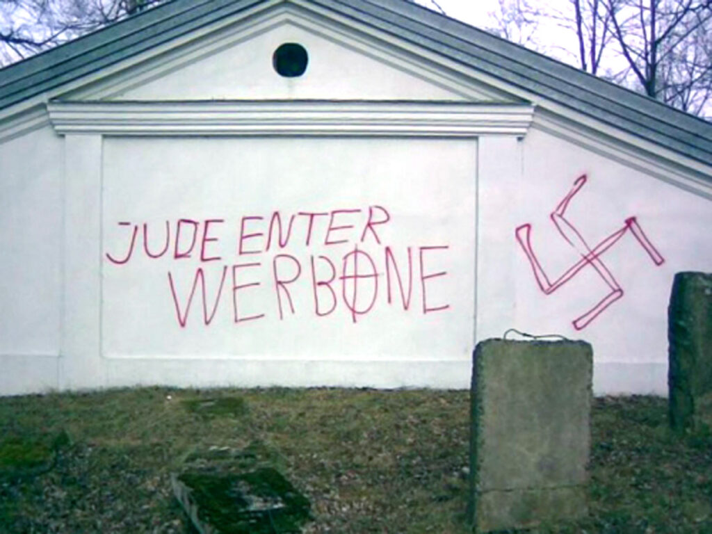 Anti Semitic inscriptions and a Nazi swastika are seen on the grave of Tzaddik Elimelech at the Jewish cemetery in Lezajsk, southeastern Poland, Thursday, March 6, 2008. Photo: AP/Foundation for the Preservation of Jewish Heritage in Poland