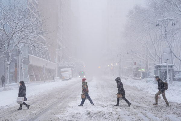 Pedestrians cross 42nd Street near Bryant Park during a snow storm, Monday, Feb. 23, 2026, in New York. Photo: Seth Wenig/AP