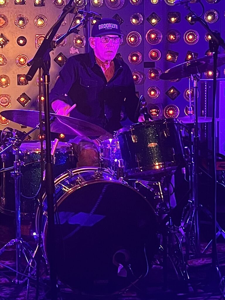Liberty DeVitto rocking out with his new band, The Slim Kings, in Williamsburg. Brooklyn Eagle photo by Wayne Daren Schneiderman