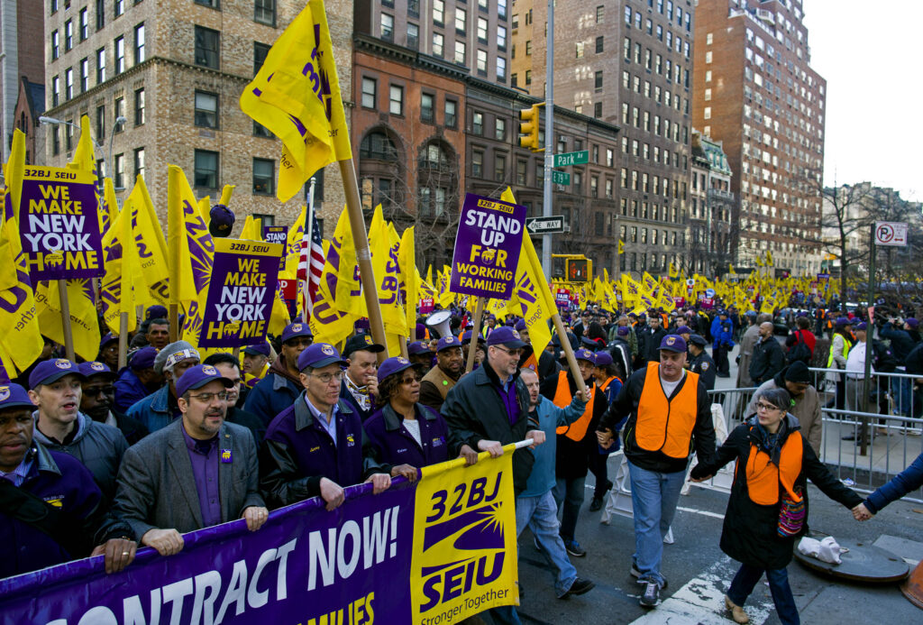 In this April 2, 2014 file photo, union and non-union apartment building workers march during a protest and march for a fair contract in New York. Photo: Craig Ruttle/AP, File