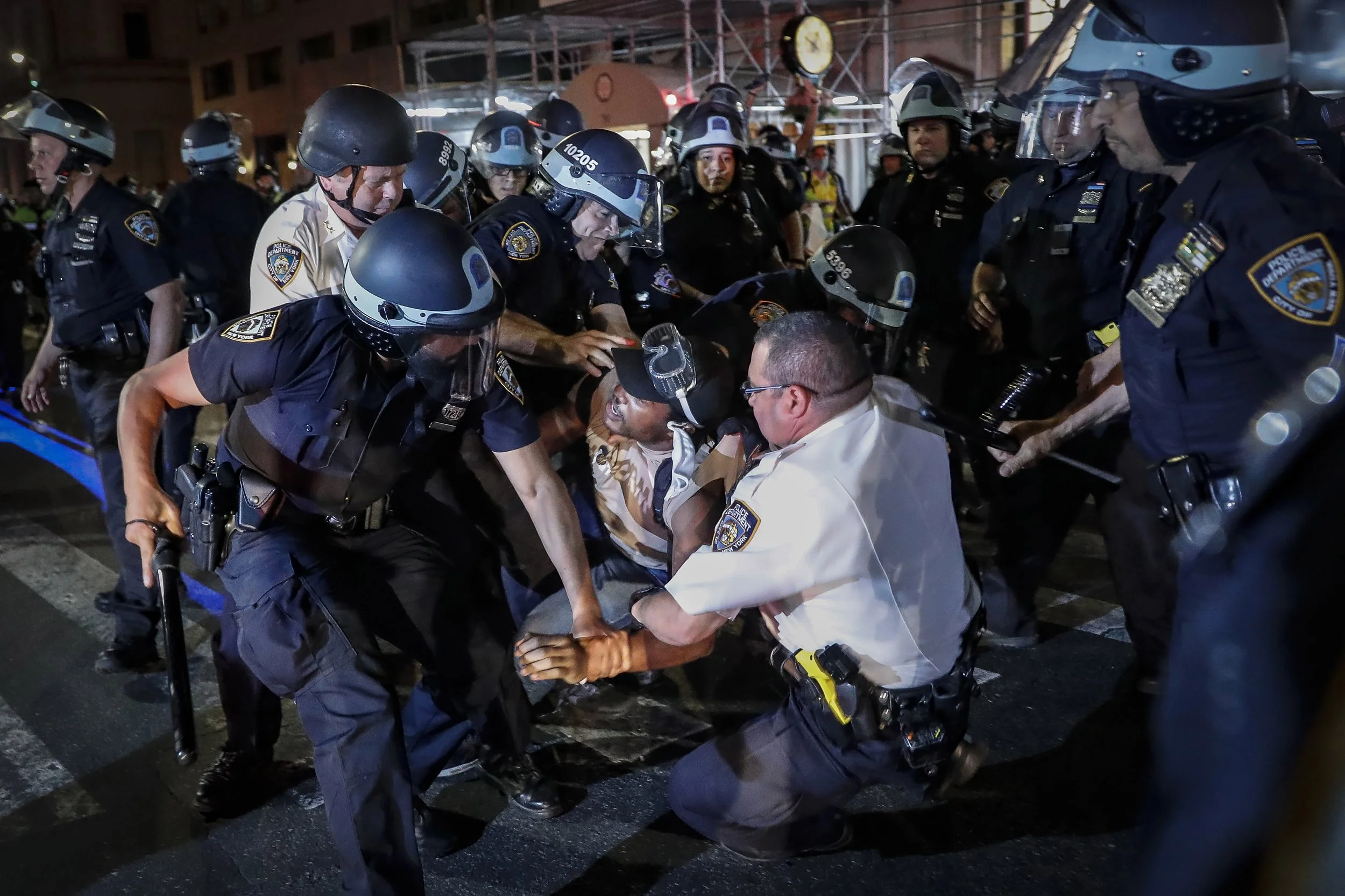 A protester is arrested on New York's Fifth Avenue by NYPD officers during a march on June 4, 2020, following the death of George Floyd. Photo: John Minchillo/AP