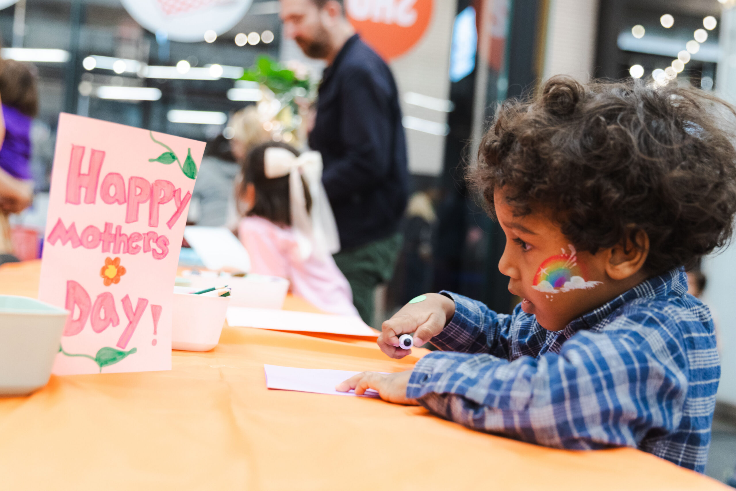 A young guest at last year’s festival makes a card for his mom. Photo: Brooklyn Org.