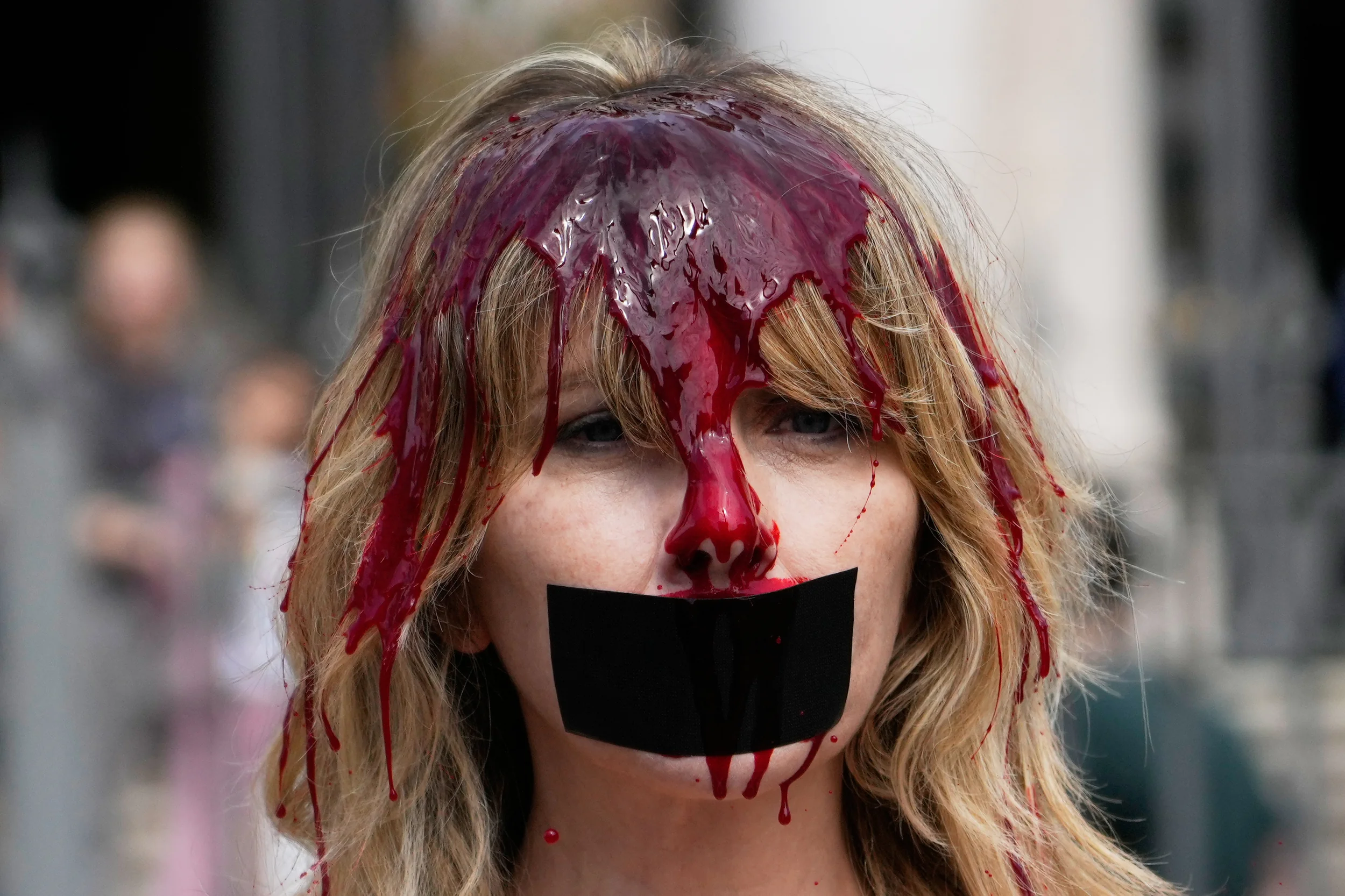 ROME — Strong visual statement for creatures unable to speak for themselves: Italian actress Loredana Cannata and activist for the Ethical Treatment of Animals (PETA), with red paint on her body, holds a placard as she protests against bullfighting and the Catholic Church's tradition of blessing bullfights, outside St. Mary Major Basilica, Thursday, April 30, 2026. Photo: Gregorio Borgia/AP