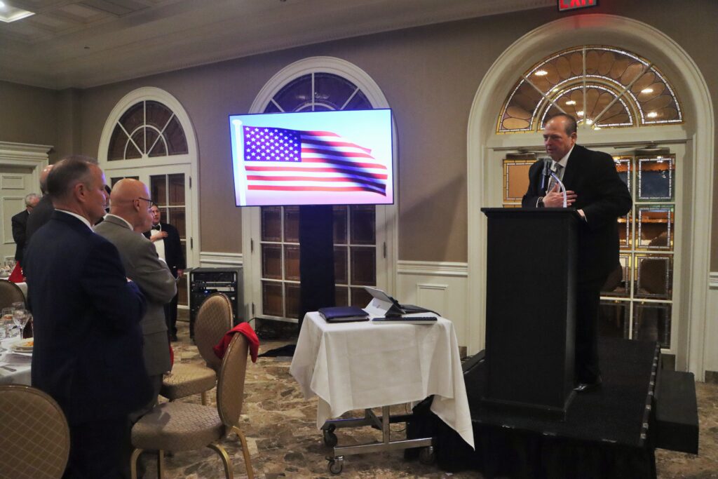 Mario Romano, Esq., and Columbian Lawyers Association members recite the Pledge of Allegiance. Photo: Mario Belluomo/Brooklyn Eagle