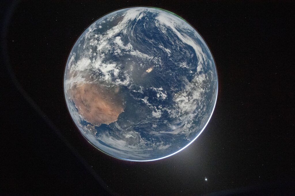 This image provided by NASA shows a view of Earth taken by NASA astronaut and Artemis II Commander Reid Wiseman from of the Orion spacecraft's window after completing the translunar injection burn on April 2, 2026. Photo: NASA via AP