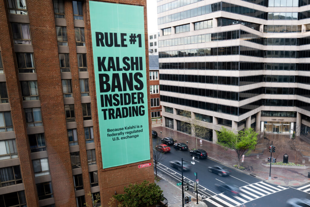 An advertisement for prediction market platform Kalshi hangs at 13th and L Streets in northwest Washington, April 1, 2026. Photo: Allison Robbert/AP, File