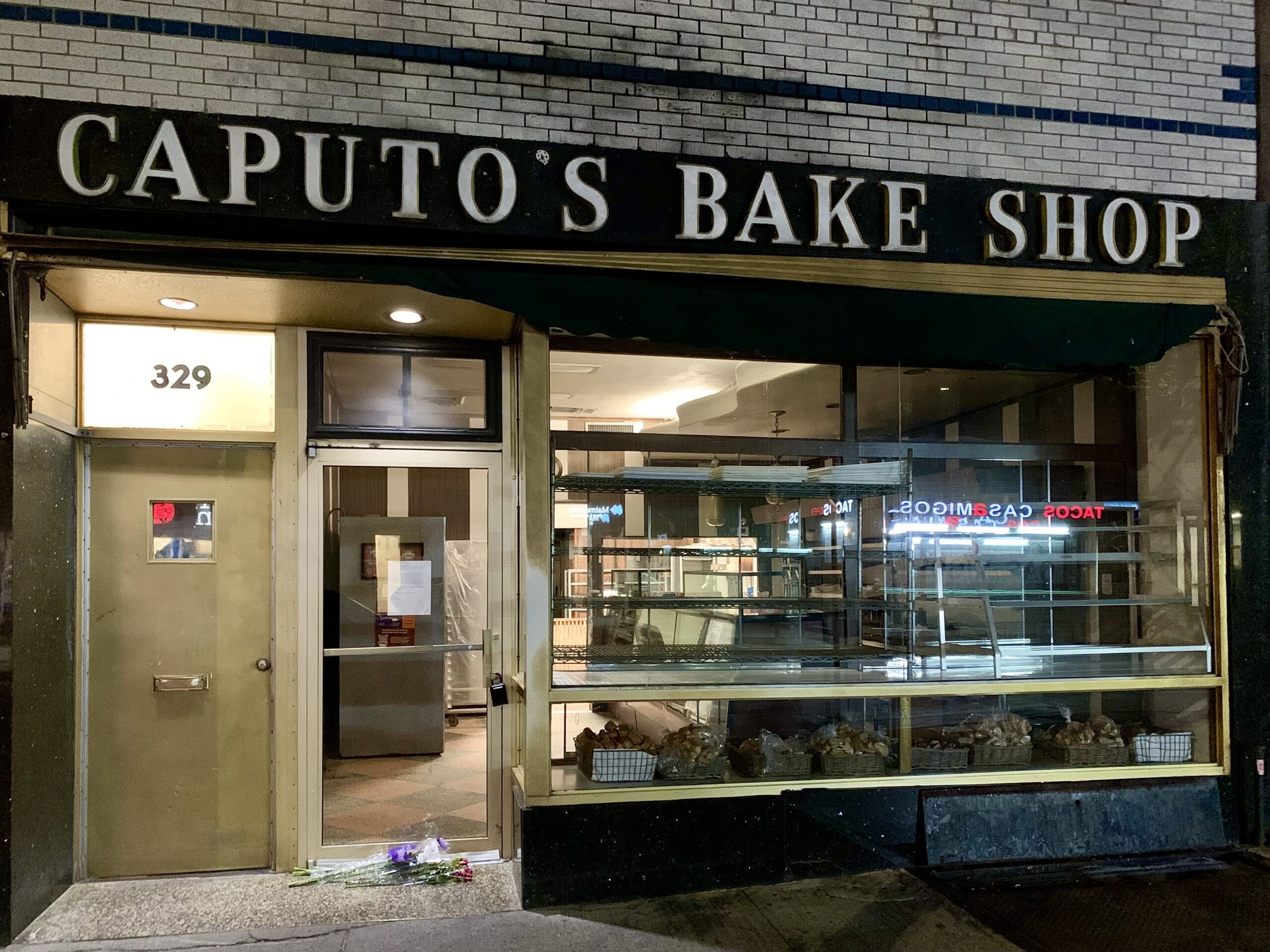 Caputo’s on Monday night, with farewell flowers visible outside its door. Photo: Mary Frost/Brooklyn Eagle