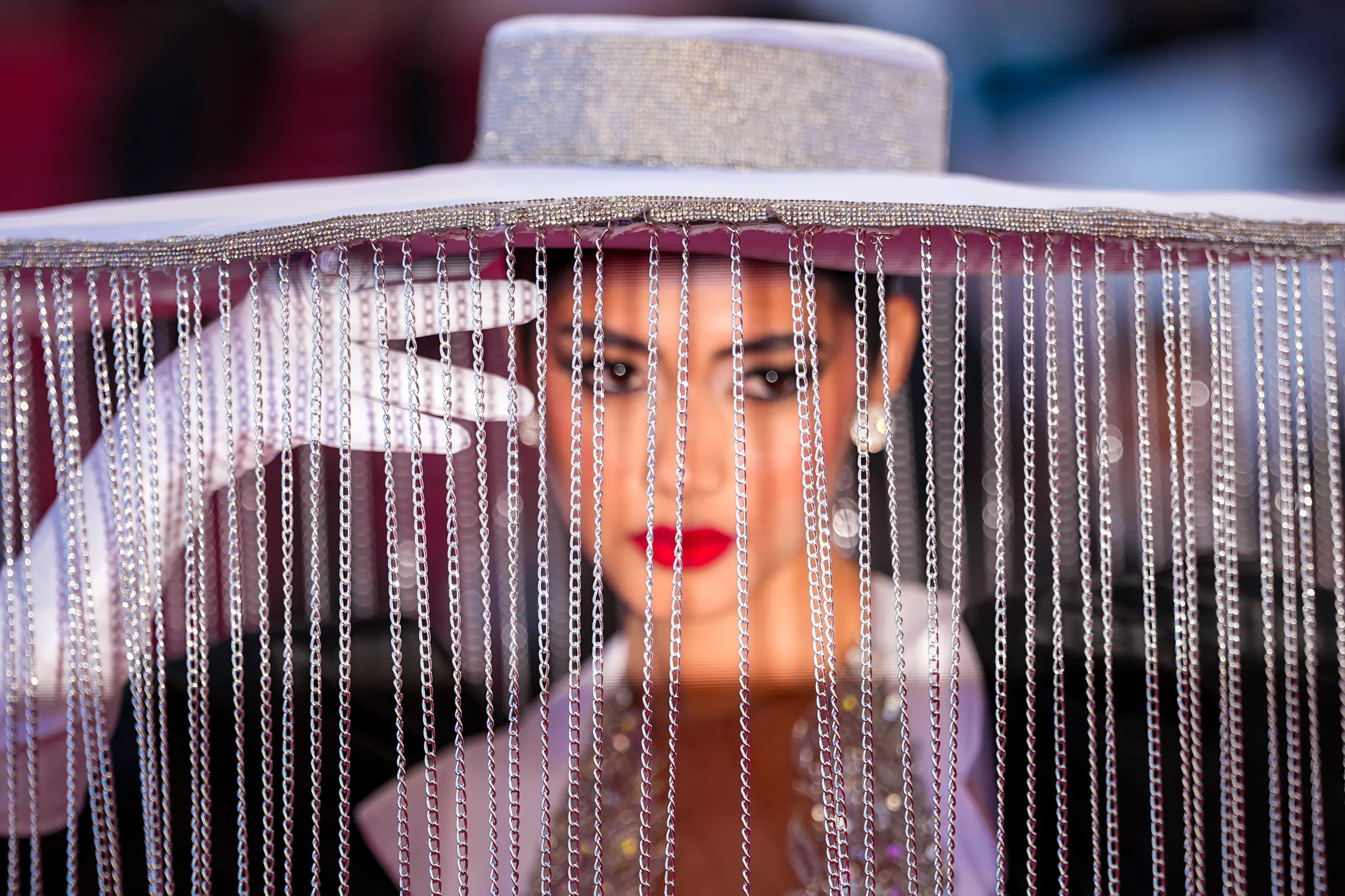CANNES — Parting the chains for a glimpse or a kiss: Rakele Menjivar poses for photographers upon arrival at the premiere of the film “Bitter Christmas” at the 79th international film festival, Cannes, southern France, Tuesday, May 19, 2026. Photo: Andreea Alexandru/AP
