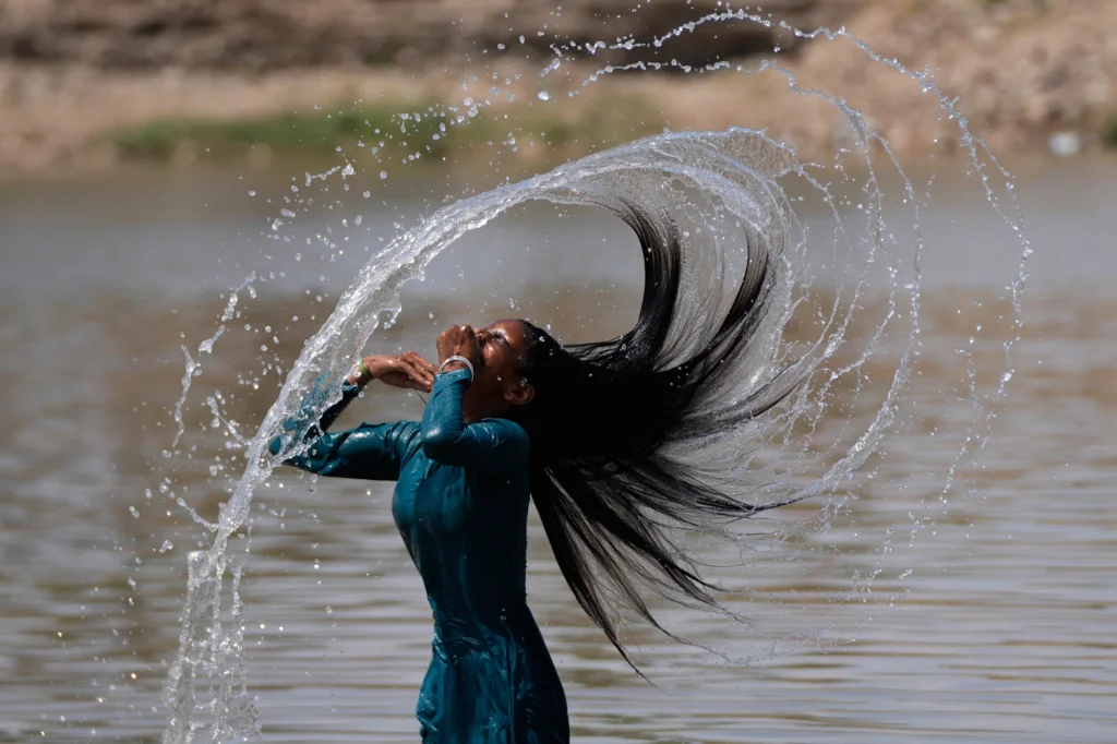 INDIA — Nobody’s doing this in the Gowanus: A girl enjoys bathing in the River Tawi on a hot summer day in Jammu, Monday, May 25, 2026. Photo: Channi Anand/AP