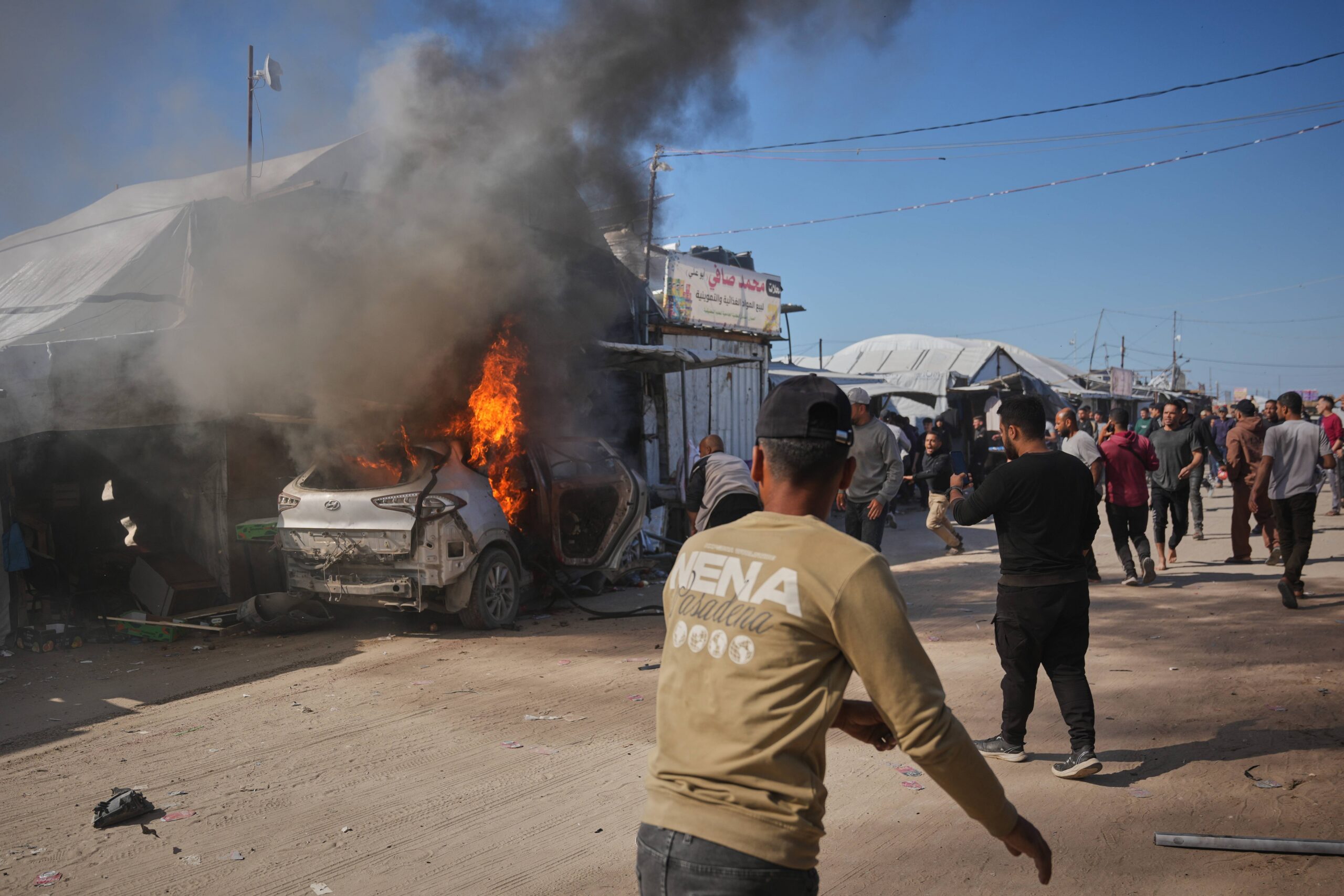 Palestinians gather around a vehicle struck by an Israeli airstrike in Khan Younis, southern Gaza Strip, Wednesday, May 6, 2026. Photo: Abdel Kareem Hana/AP