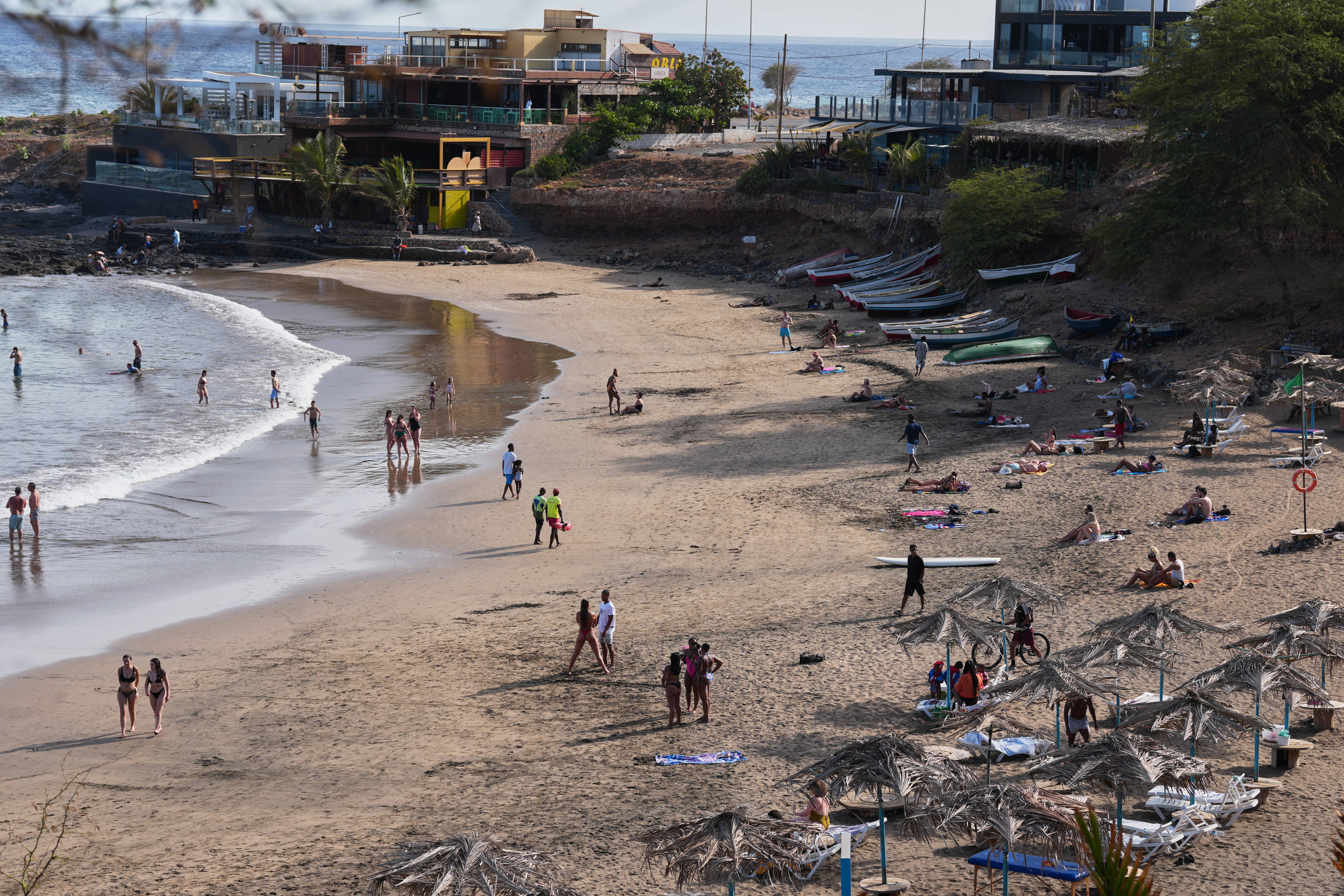 A general view of tourist on a beach in Praia, Cape Verde, Thursday, May 7, 2026. Photo: Misper Apawu/AP