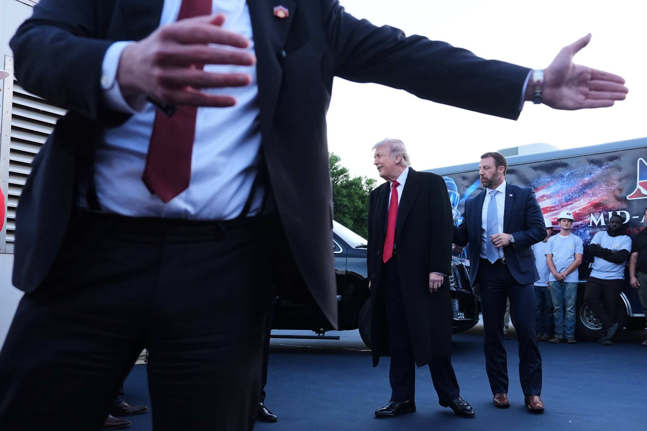 President Donald Trump speaks as he visits the Lincoln Memorial Reflecting Pool to see the new blue protective coating being applied as part of a renovation project, Thursday, May 7, 2026, in Washington. Photo: Mark Schiefelbein/AP