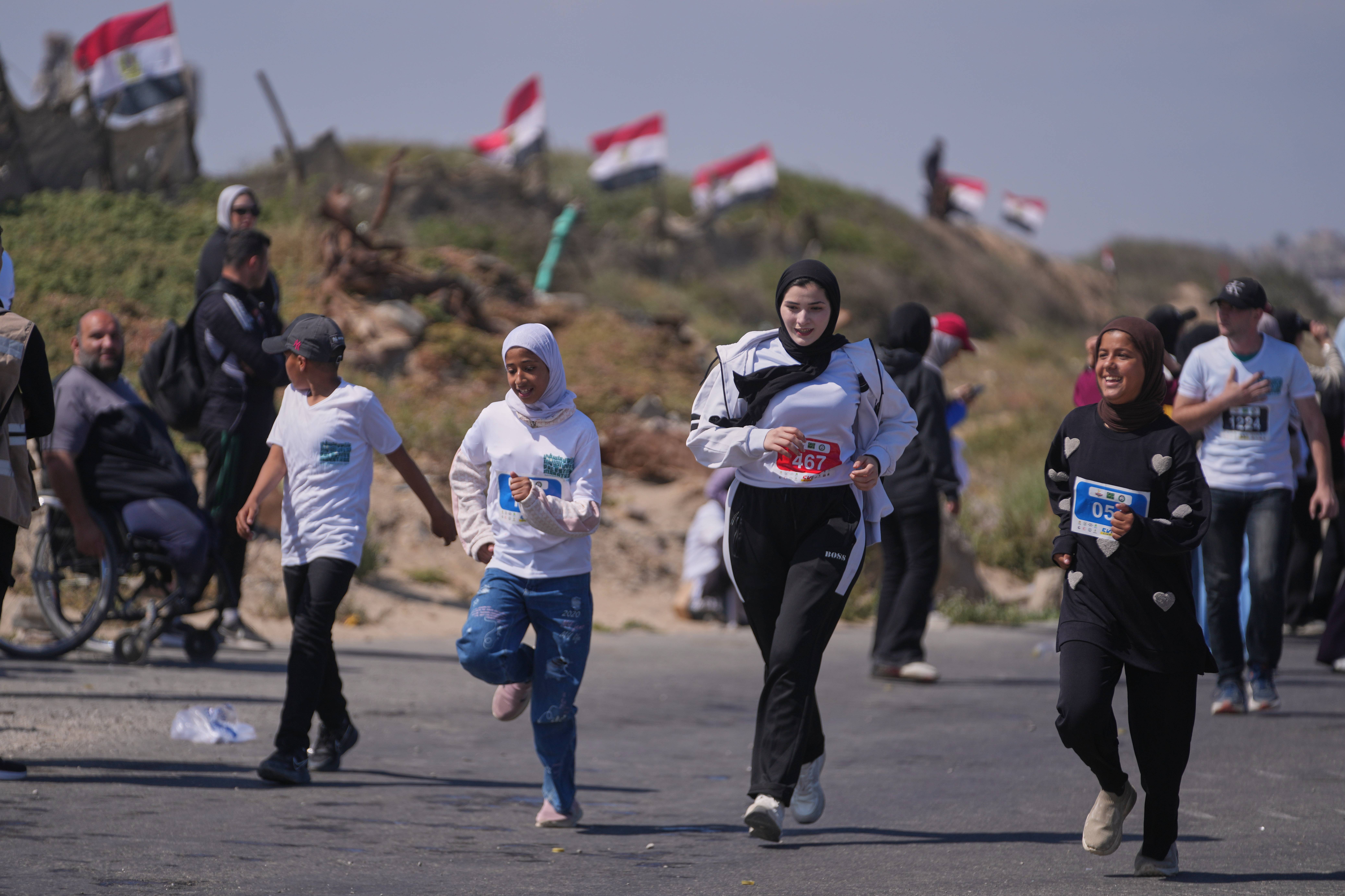 Palestinian women runners take part in the 5-kilometer Palestine Marathon along the coastal road near Nuseirat in the central Gaza Strip, Friday, May 8, 2026. Photo: Abdel Kareem Hana/AP