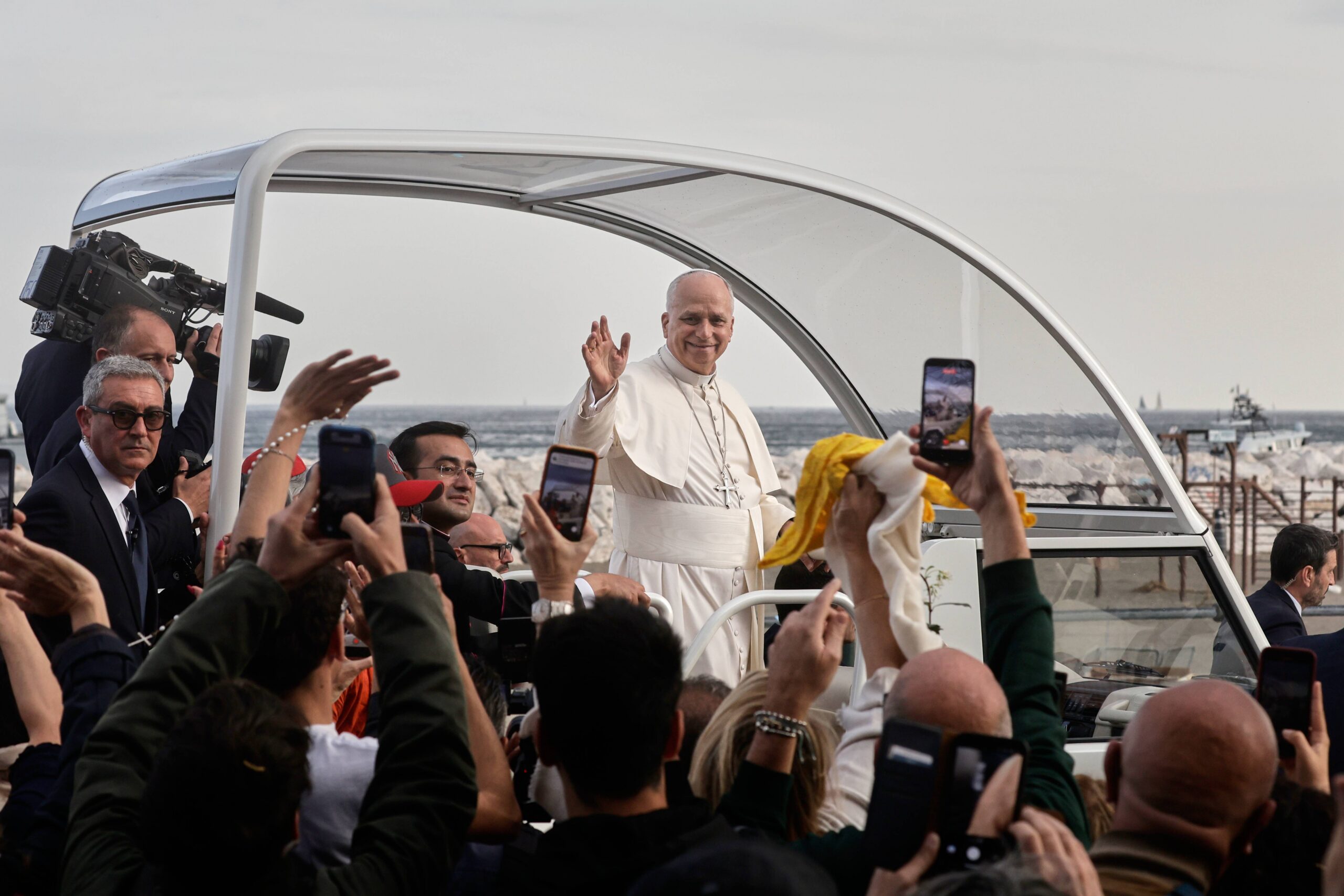Pope Leo XIV waves from the popemobile as he leaves Naples at the end of a one-day pastoral visit to Pompeii and Naples, Friday, May 8, 2026. Photo: Salvatore Laporta/AP