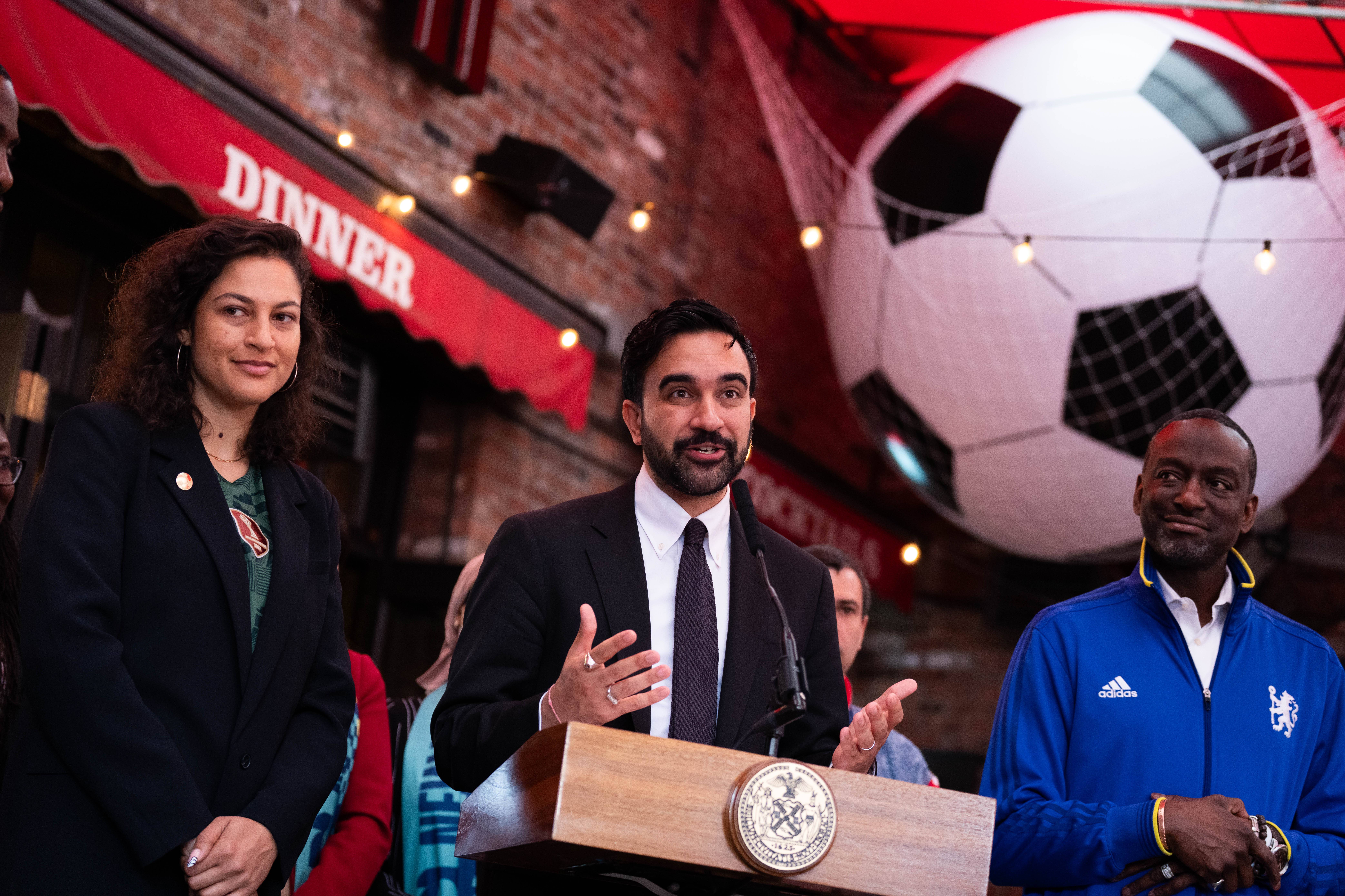 New York Mayor Zohran Mamdani, alongside NYC World Cup Czar Maya Handa, NYC World Cup Czar, left, and New York council member Yusef Salaam, makes a World Cup soccer tournament announcement at Harlem Tavern, Thursday, May 21, 2026 in New York. Photo: Adam Gray/AP