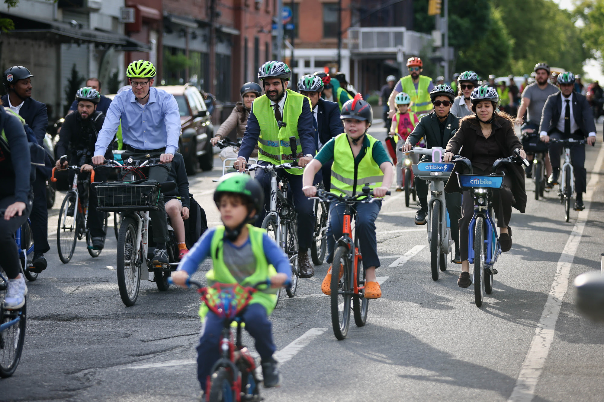 Mayor Mamdani and DOT head Mike Flynn bike to school with the Bergen Bike Bus. Photo: NYC DOT
