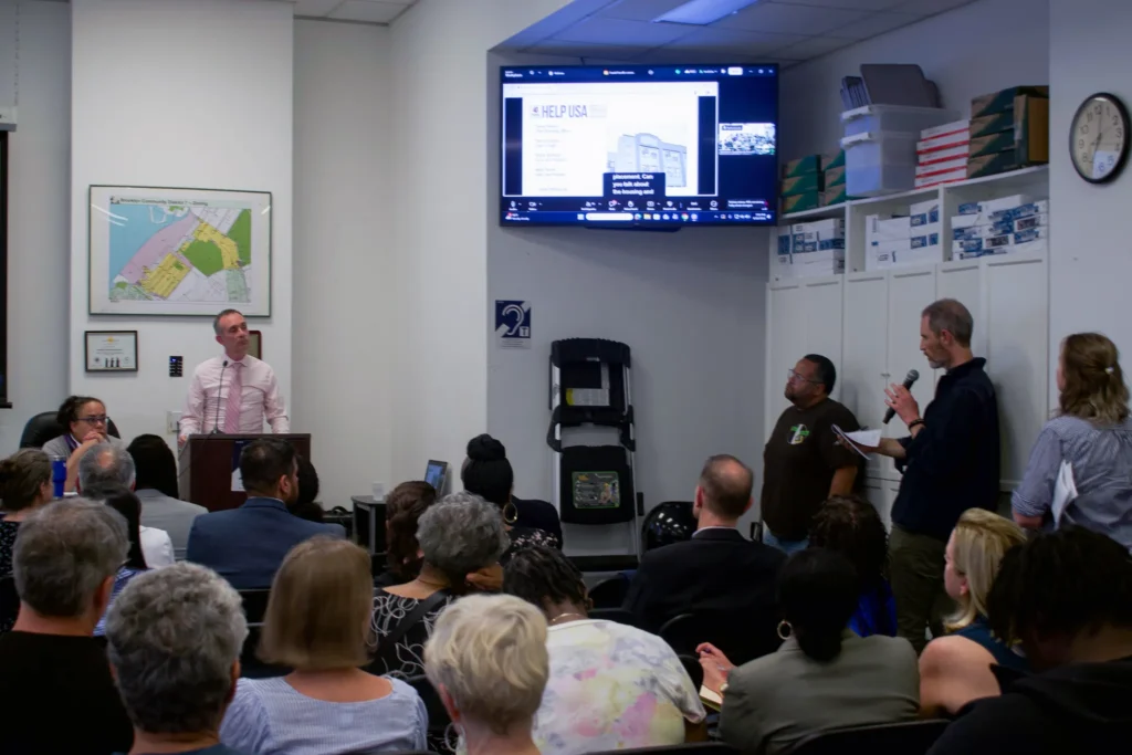 Greenwood Heights residents speak out against a HELP USA shelter during a Community Board 7 meeting, June 10, 2026. Credit: Siddhartha Harmalkar
