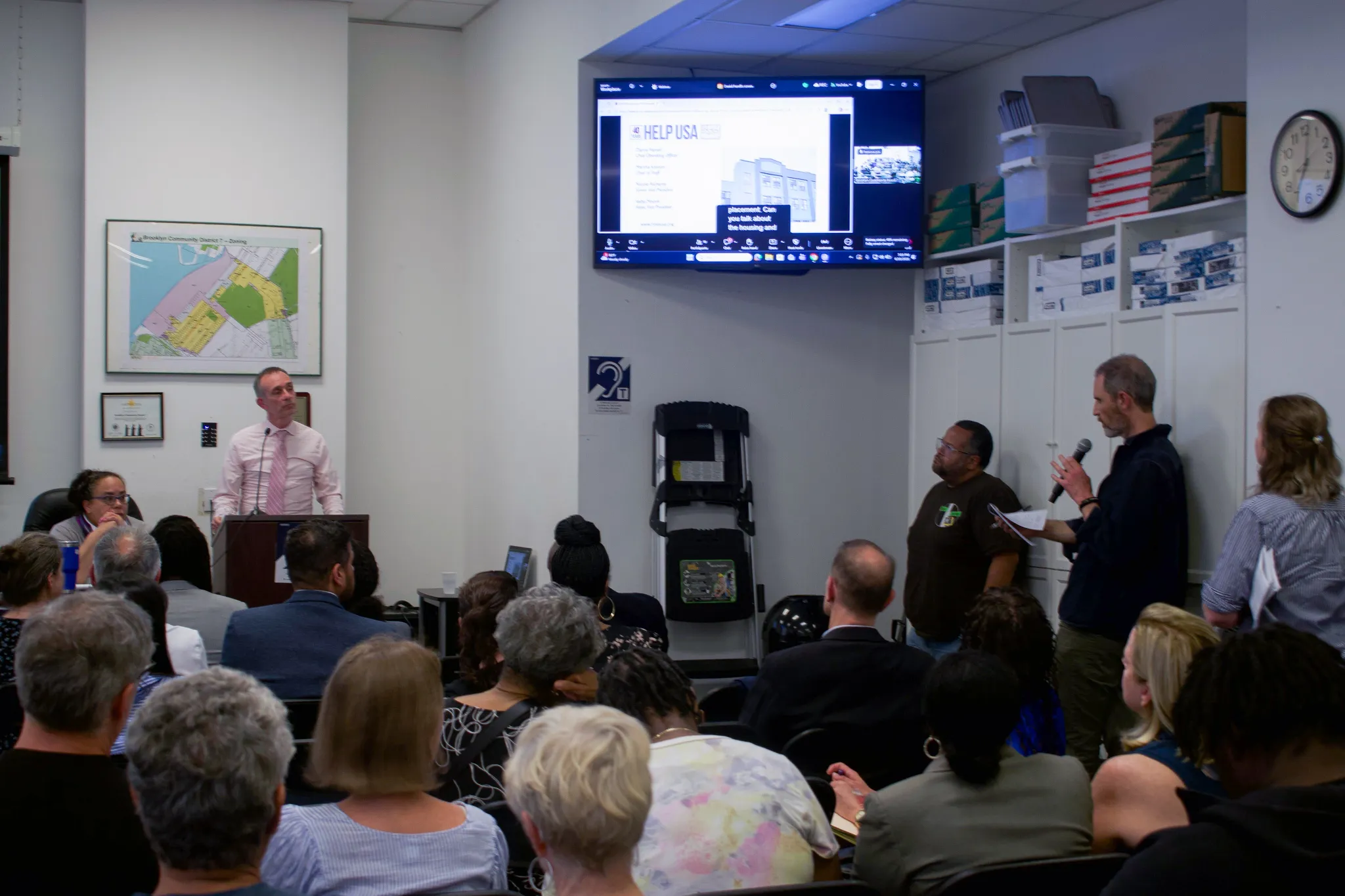 Greenwood Heights residents speak out against a HELP USA shelter during a Community Board 7 meeting, June 10, 2026. Credit: Siddhartha Harmalkar