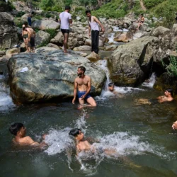 KASHMIR — Nature’s swimming hole: Kashmiris cool off at a stream on a hot summer day on the outskirts of Srinagar, Indian controlled Kashmir, Tuesday, June 30, 2026. Photo: Dar Yasin/AP