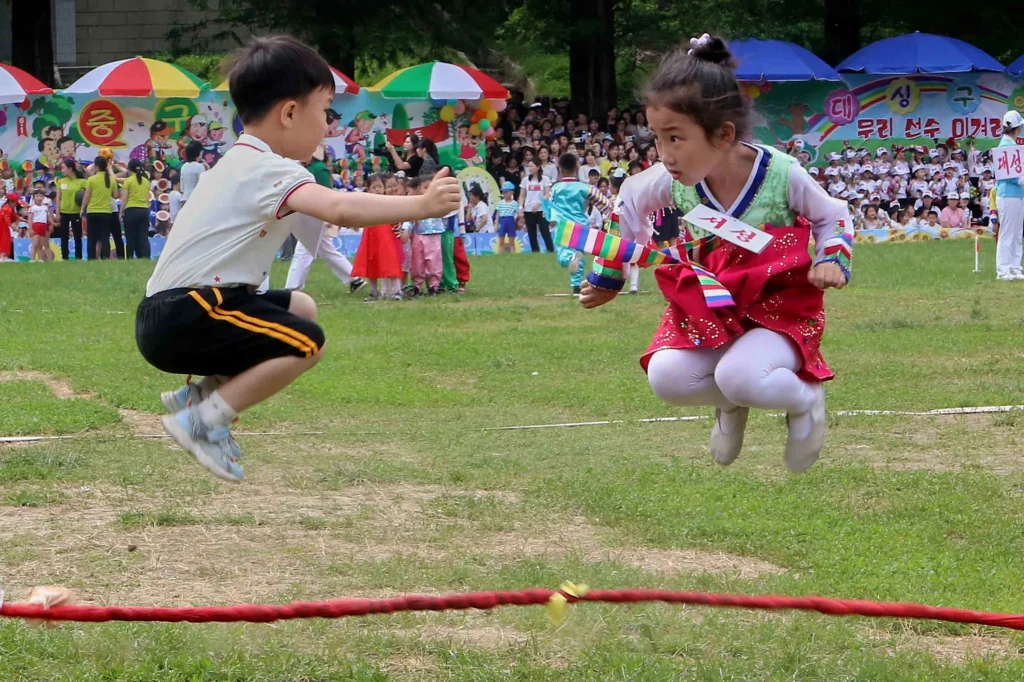 NORTH KOREA — Is there more determination than fun here? Children take part in a game during the 76th anniversary of the June 1 International Children's Day at the Taesongsan Pleasure Park in Pyongyang, North Korea, Monday, June 1, 2026. Photo: Jon Chol Jin/AP