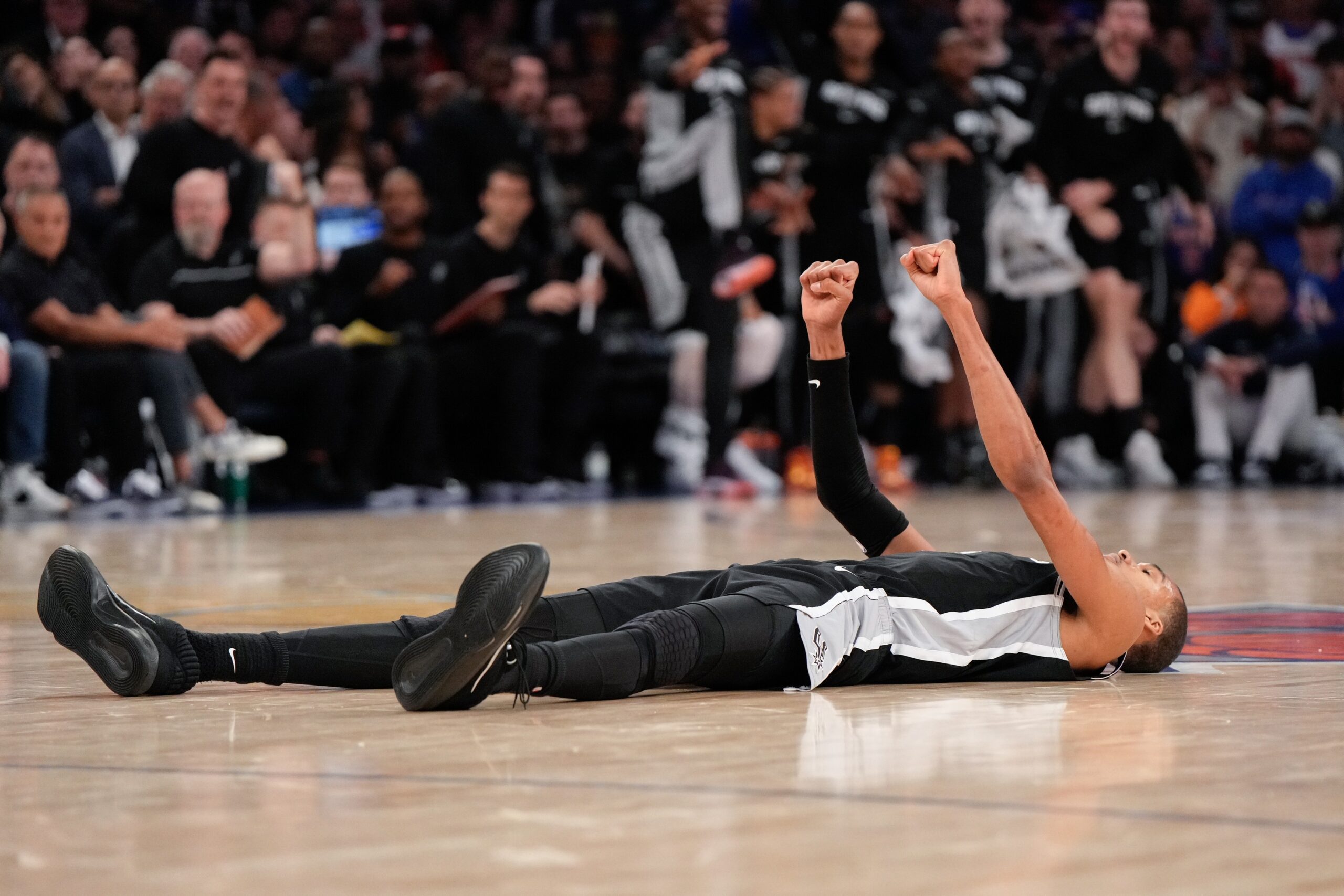 San Antonio Spurs forward Victor Wembanyama lies on the court after a shot during second half of Game 3 of the NBA Finals basketball series against the New York Knicks, Monday, June 8, 2026, in New York. Photo: Ross D. Franklin/AP
