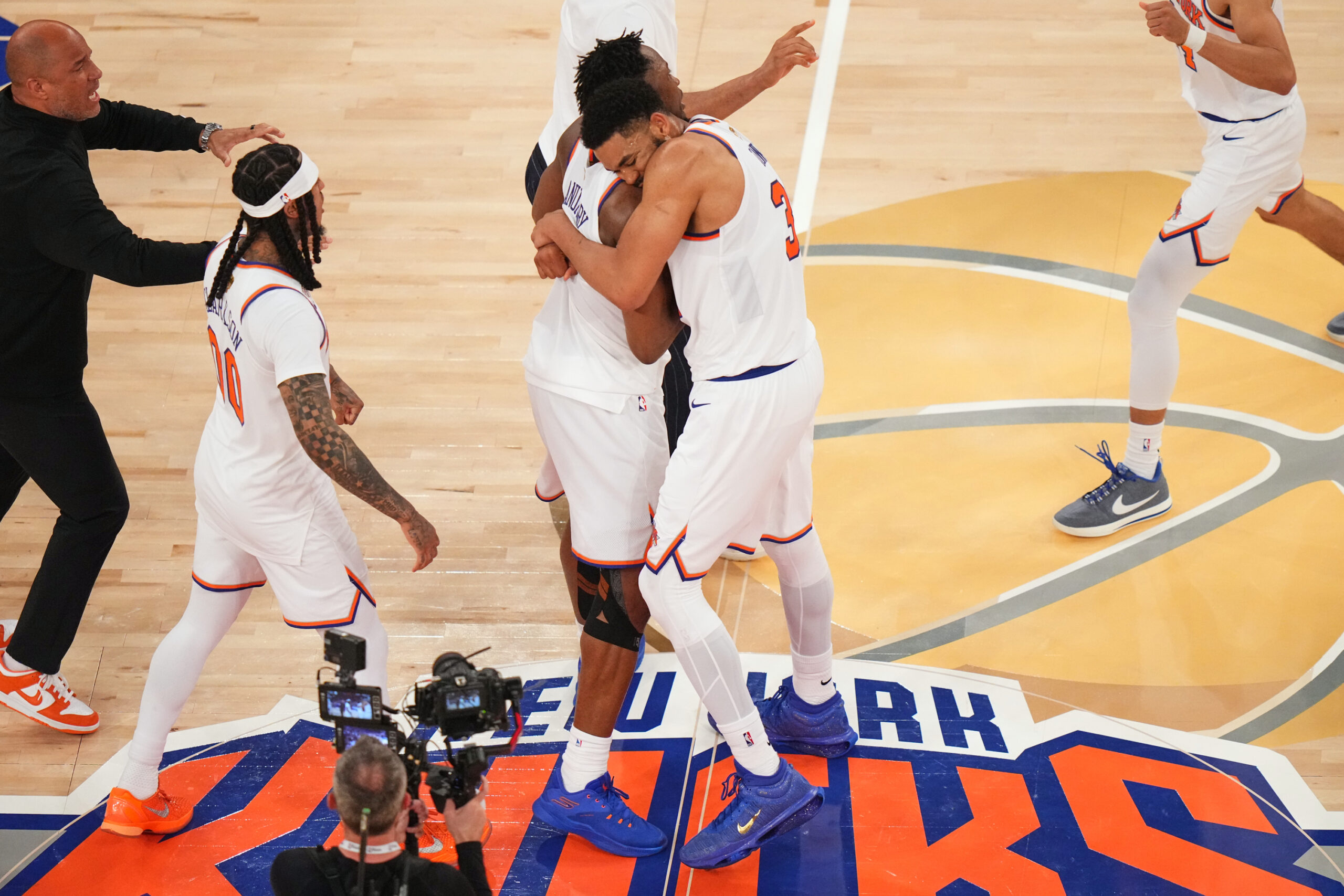 New York Knicks center Karl-Anthony Towns (32) hugs forward Og Anunoby (8) after the team's victory over the San Antonio Spurs in Game 4 of the NBA Finals basketball series, Wednesday, June 10, 2026, in New York. Photo: Frank Franklin II/AP