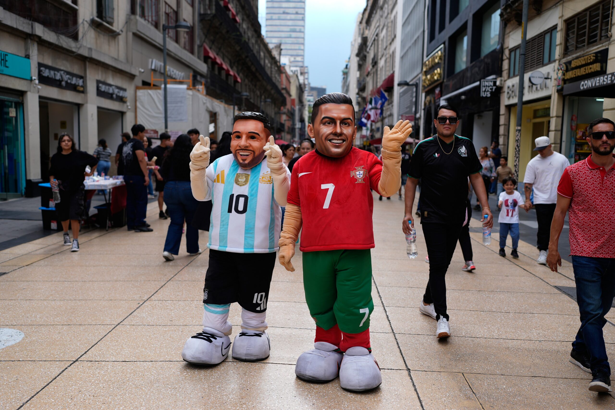 Mascots portraying soccer stars Lionel Messi and Cristiano Ronaldo greet passersby in the historic center of Mexico City, Tuesday, June 16, 2026. Photo: Marco Ugarte/AP