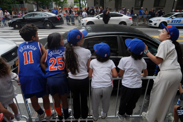 Fans line up along the route before the New York Knicks' NBA championship parade Thursday, June 18, 2026, in New York. (AP Photo/Ryan Murphy)