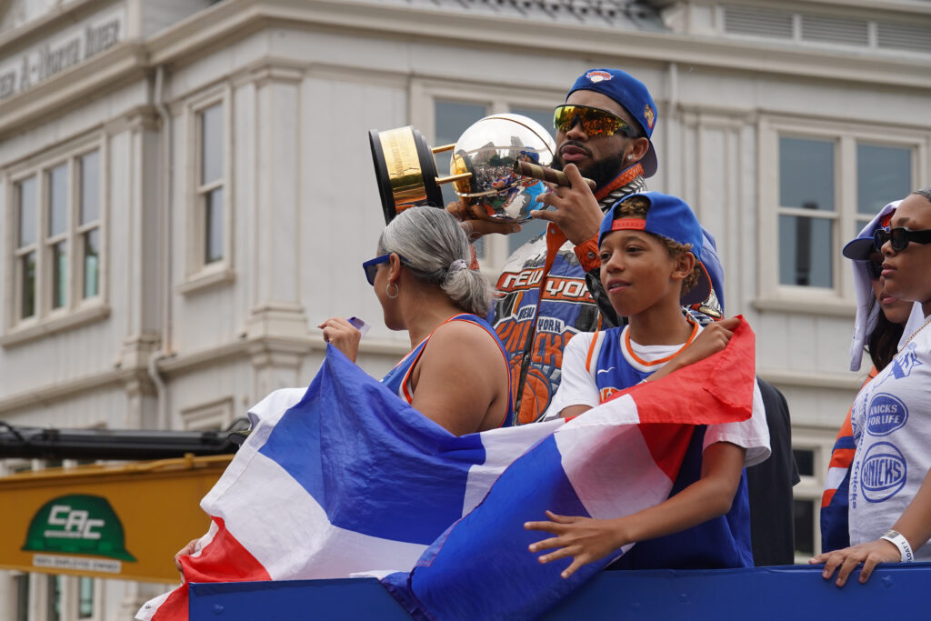 New York Knicks center Karl-Anthony Towns holds up the trophy during the New York Knicks' NBA championship parade Thursday, June 18, 2026, in New York. Photo: Ryan Murphy/AP